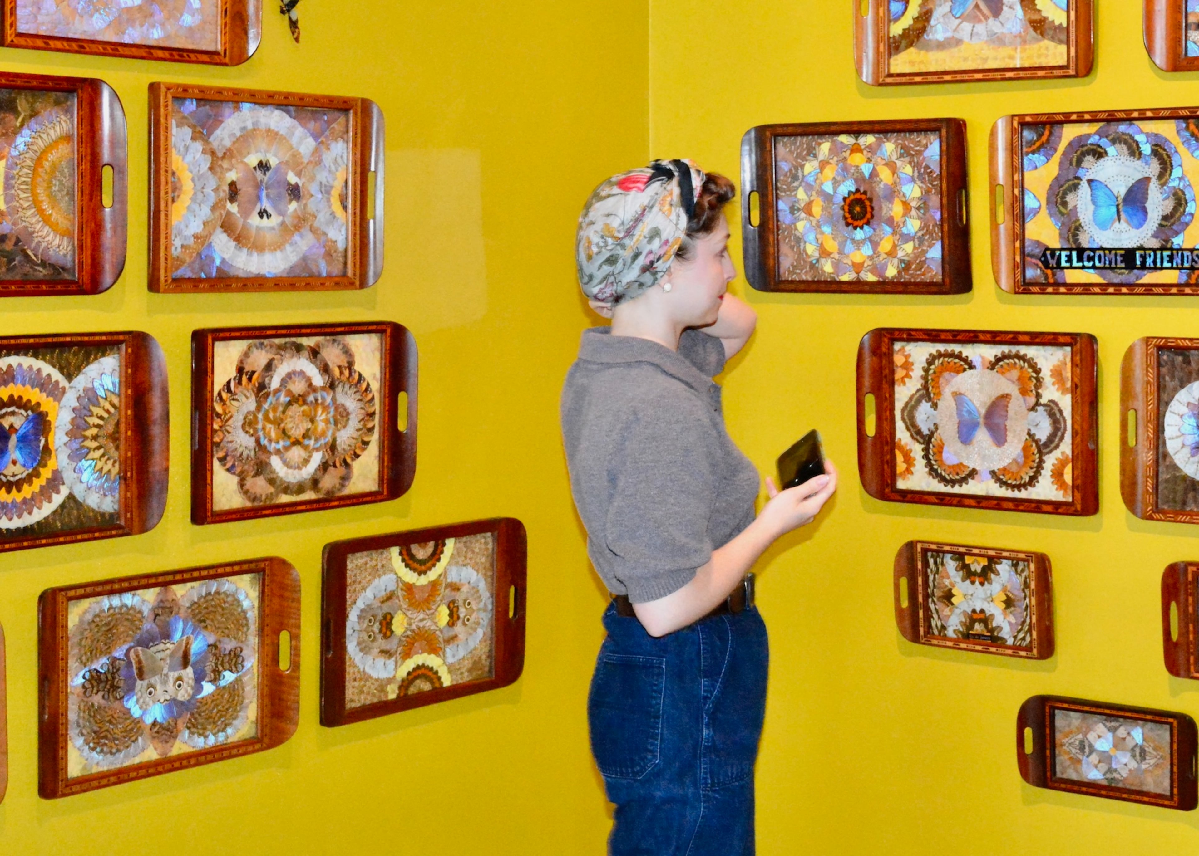 A Zuckerman Museum of Art guest takes in the "Lady Bug" exhibit after artist Jennifer Angus' recent gallery talk. (Photo by Alanna Foxwell)