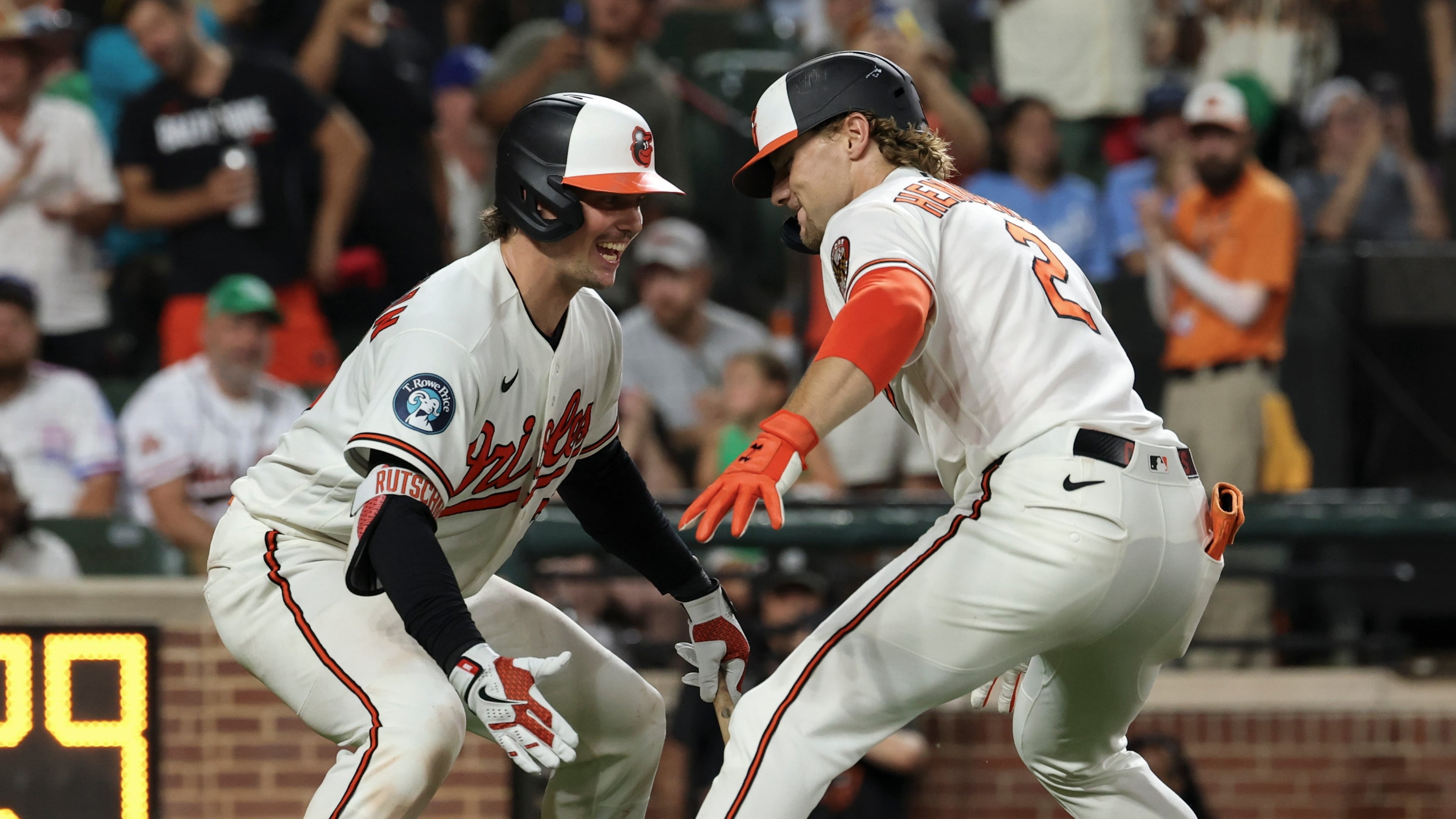 Baltimore Orioles' Gunnar Henderson (2) celebrates with Adley Rutschman, left, after hitting a home run off Kansas City Royals pitcher Eli Morgan during the eighth inning of a baseball game, Saturday, July 11, 2026, in Baltimore. (AP Photo/Terrance Williams)