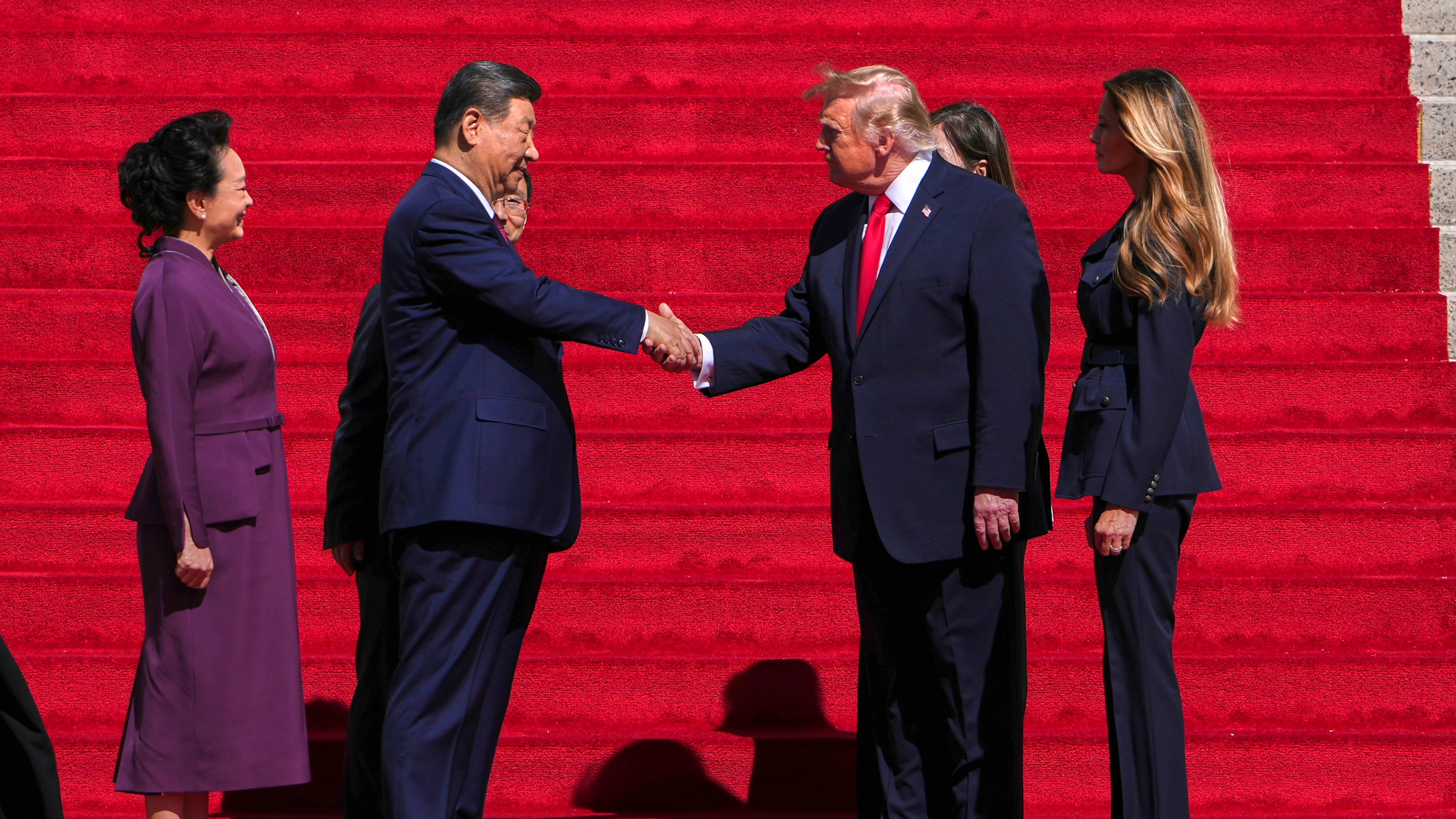 President Donald Trump, center right, shakes the hand of China's President Xi Jinping as first lady Melania Trump, right, and China's first lady Peng Liyuan, left, watch as they arrive at the National Archives Museum, Friday, Sept. 25, 2026, in Washington. (AP Photo/Julia Demaree Nikhinson)
