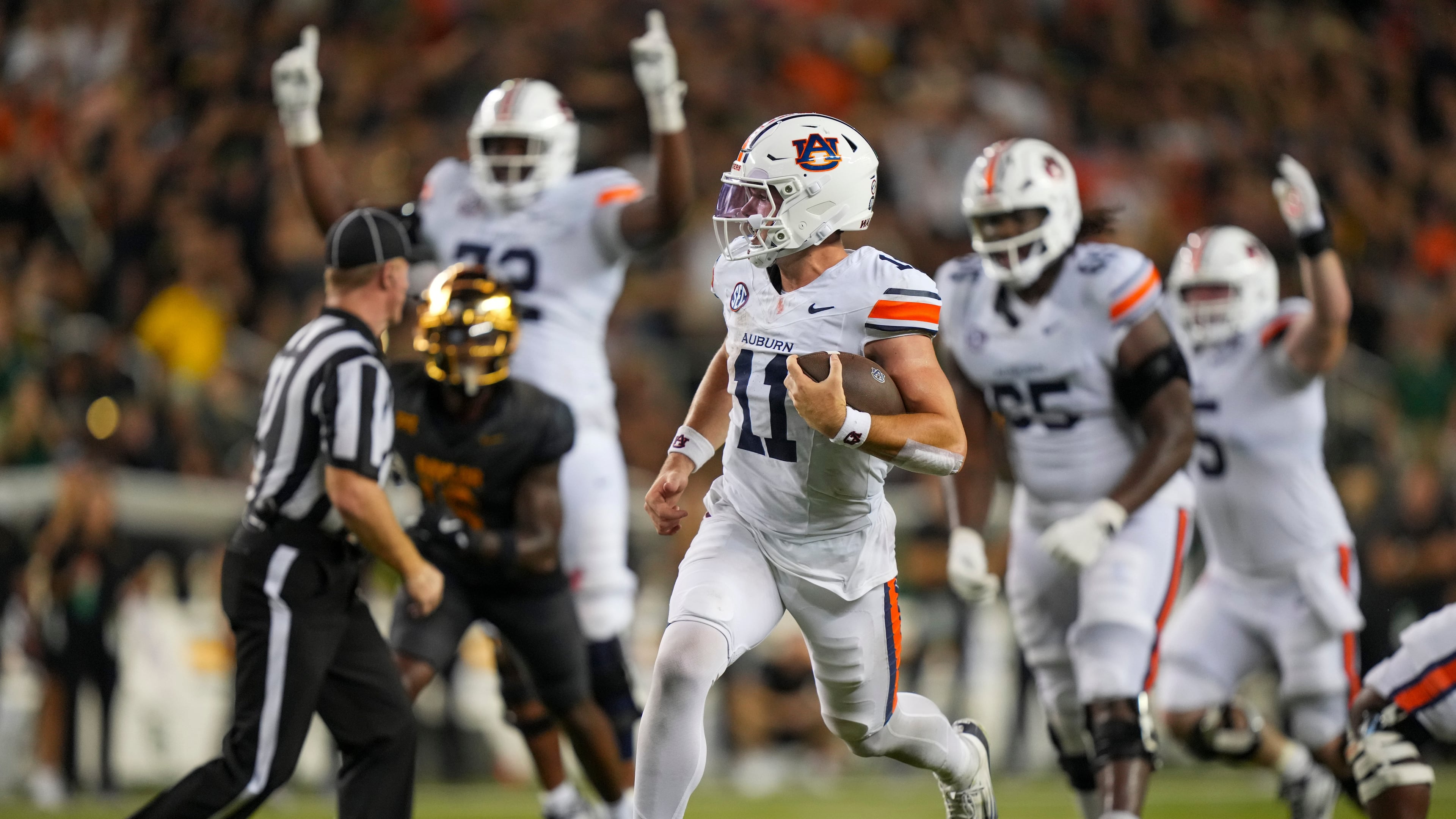 FILE - Auburn quarterback Jackson Arnold (11) runs for a touchdown against Baylor during the second half of an NCAA college football game, Aug. 29, 2025, in Waco, Texas. (AP Photo/Julio Cortez, File)