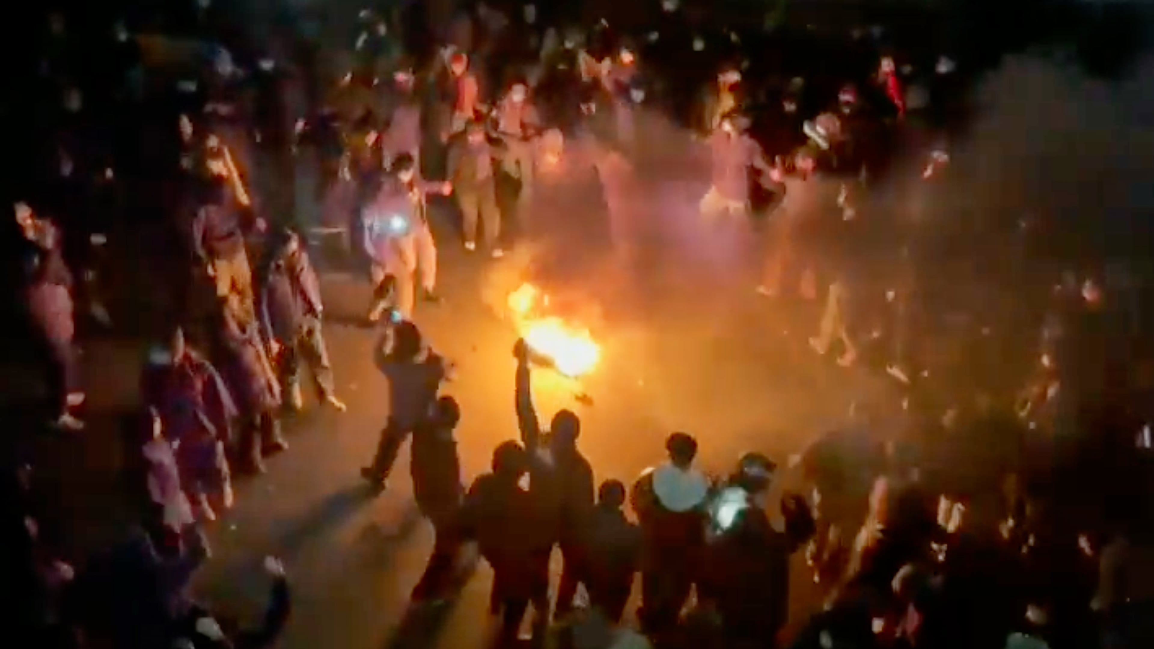 In this frame grab from footage circulating on social media shows protesters dancing and cheering around a bonfire as they take to the streets despite an intensifying crackdown as the Islamic Republic remains cut off from the rest of the world, in Tehran, Iran, Friday, Jan. 9, 2026.(UGC via AP)