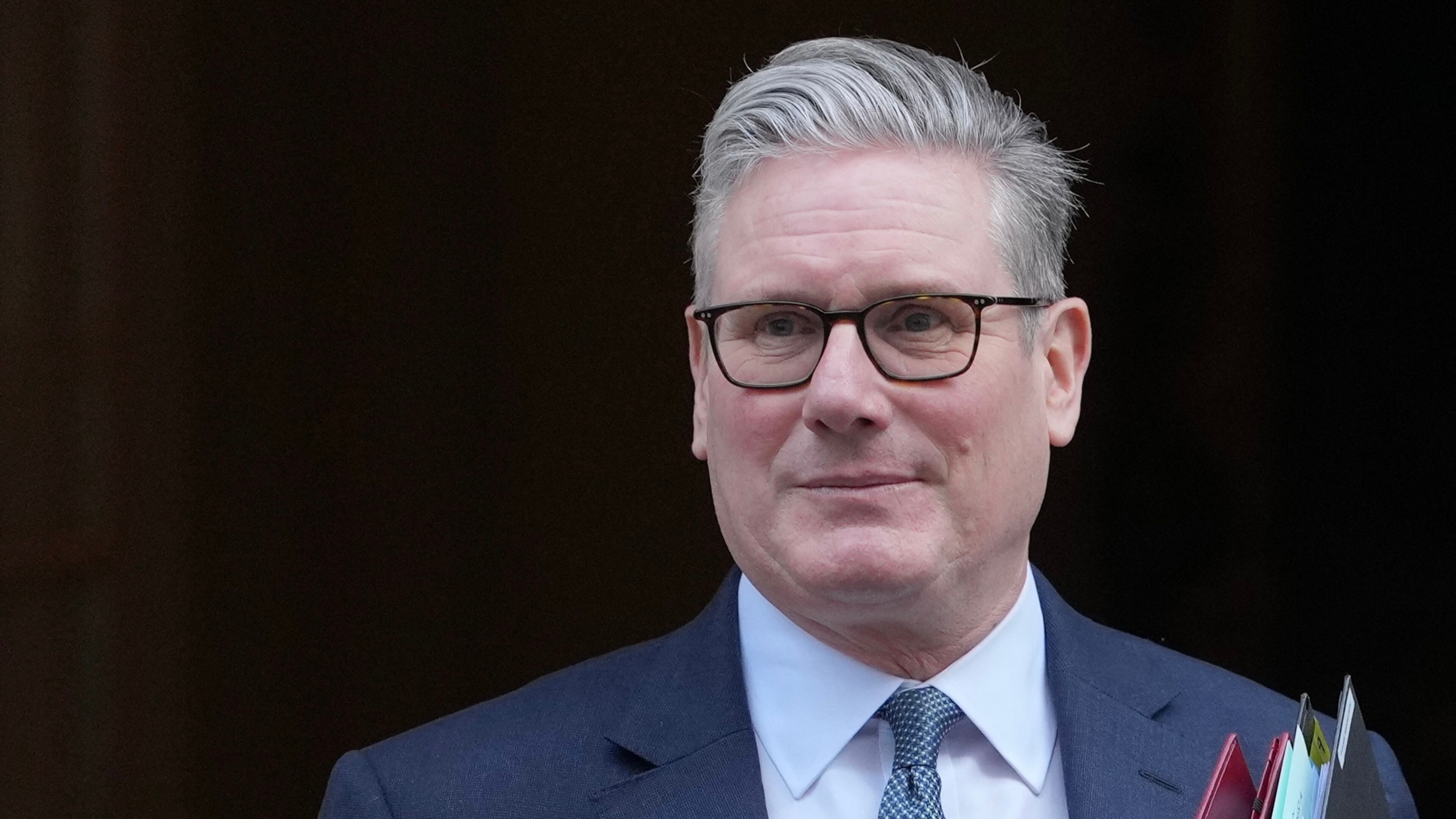 Britain's Prime Minister Keir Starmer leaves 10 Downing Street to attend the weekly Prime Ministers' Questions session in parliament in London, Wednesday, Feb. 25, 2026. (AP Photo/Kin Cheung)