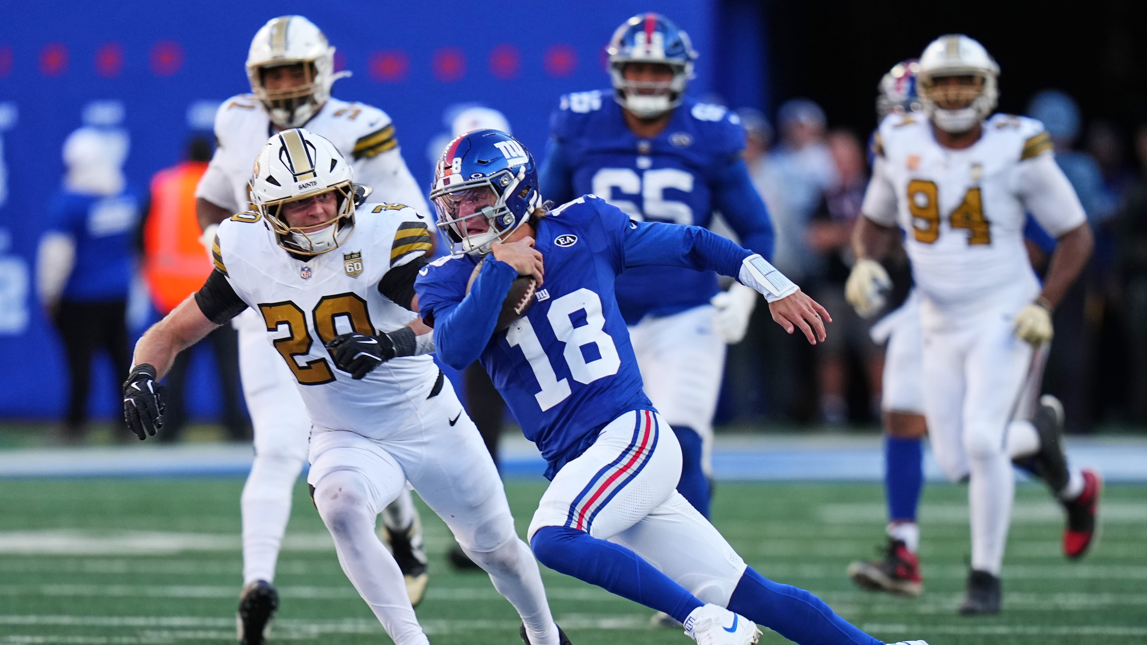 New York Giants quarterback J.J. McCarthy (18) runs the ball during the second half of an NFL football game against the New Orleans Saints in East Rutherford, N.J., Sunday, Oct. 18, 2026. (AP Photo/Frank Franklin II)