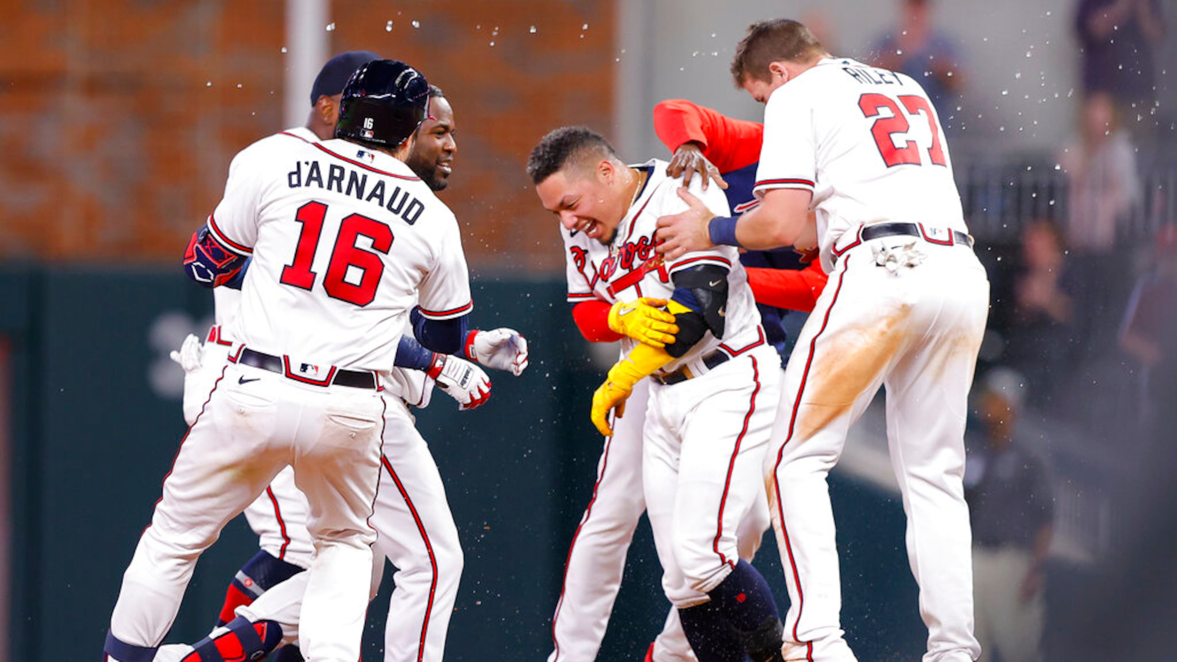Atlanta's William Contreras reacts with teammates after his game-winning single in the ninth inning against the Phillies on Tuesday night at Truist Park. (AP Photo/Todd Kirkland)
