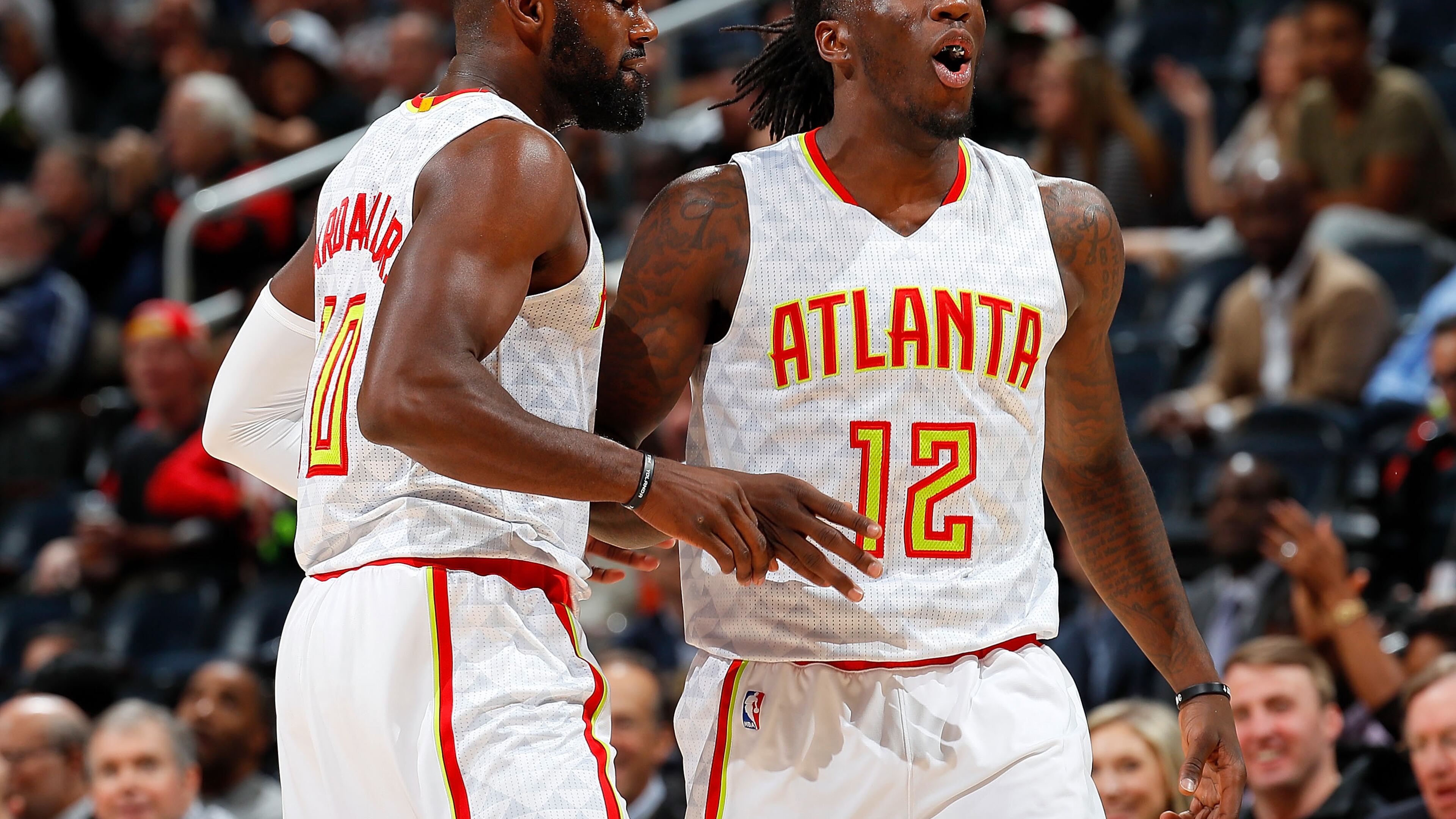 Taurean Prince (12) of the Atlanta Hawks reacts after assisting on a 3-point basket by Tim Hardaway Jr. (10) against the Milwaukee Bucks at Philips Arena on November 16, 2016 in Atlanta, Georgia. (Photo by Kevin C. Cox/Getty Images)