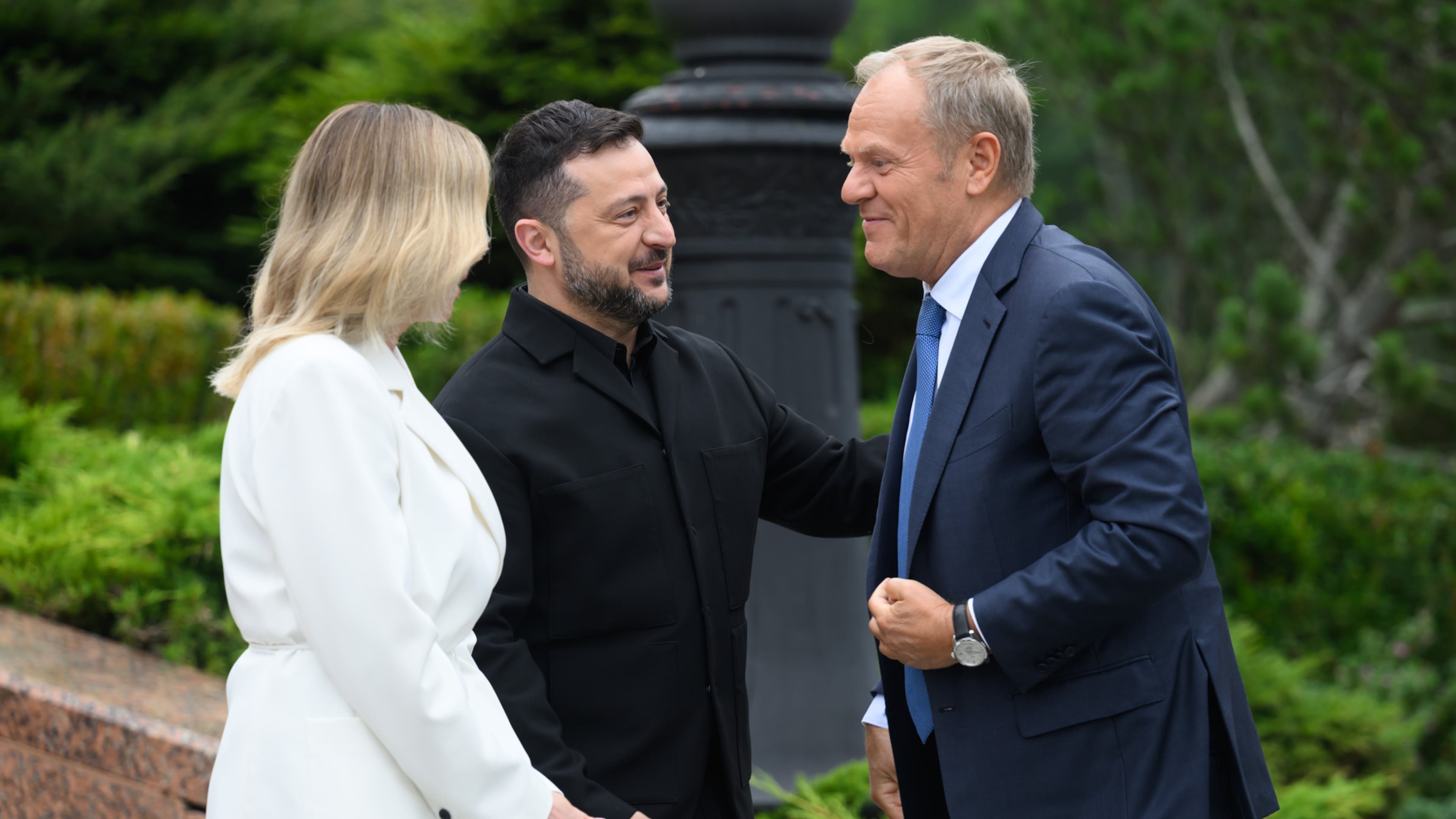 In this photo provided by the Ukrainian Presidential Press Office, Poland's Prime Minister Donald Tusk, right, is welcomed by Ukraine's President Volodymyr Zelensky and his wife Olena Zelenska during a Carpathian 8 Summit in Bukovel, western Ukraine, Friday, Sept. 18, 2026. (Ukrainian Presidential Press Office via AP)