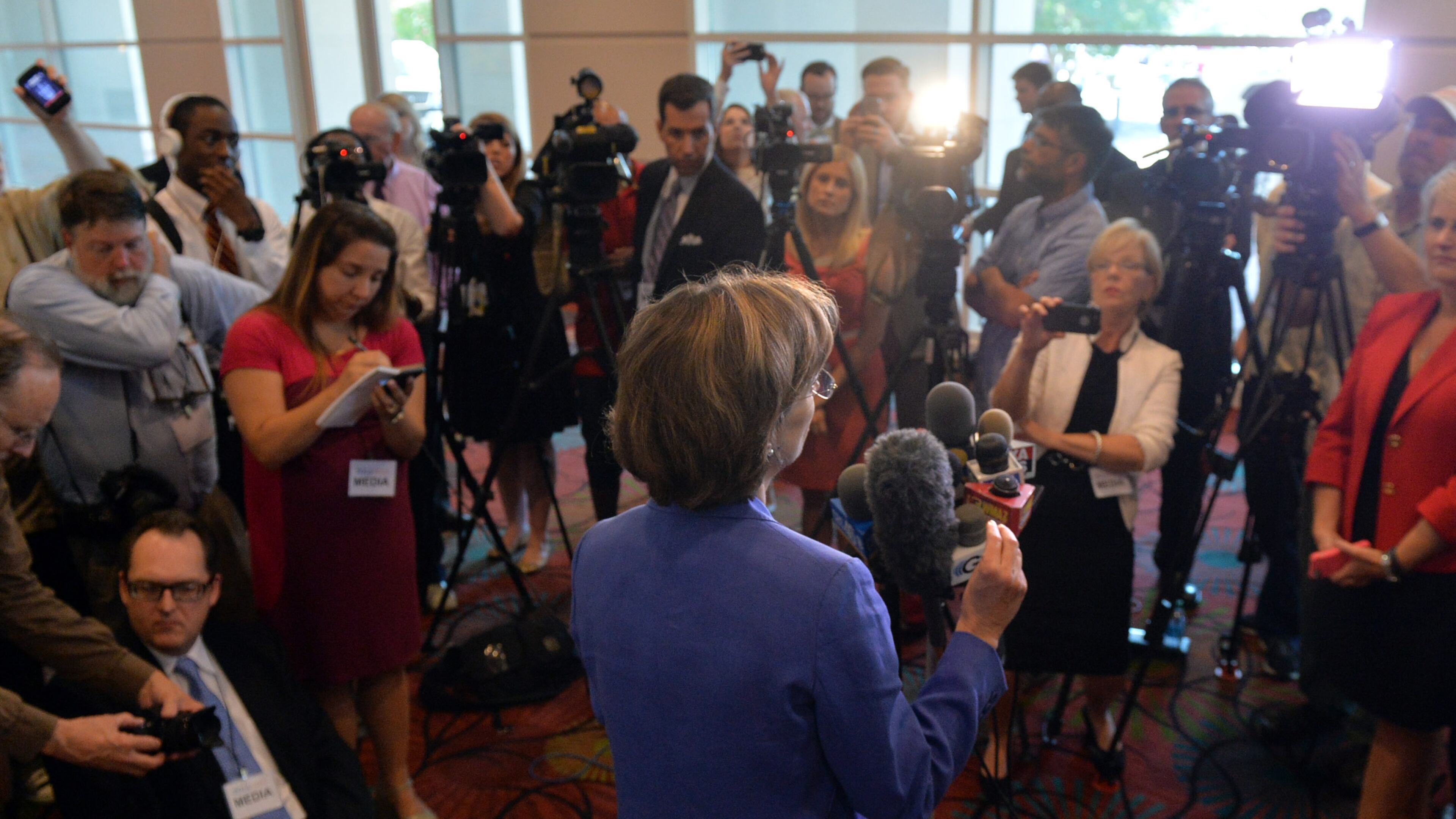 AUGUST 21, 2014 MACON U.S. Senate candidate Michelle Nunn speaks to the media after she and her Republican opponent David Perdue participated in a forum sponsored by the Georgia Chamber at the Marriott City Center in Macon, Thursday, August 21, 2014. Over 1100 people came out to hear what they would do for Georgians if elected to the U.S. Senate in the November election. KENT D. JOHNSON / KDJOHNSON@AJC.COM U.S. Senate candidate Michelle Nunn speaks to the media after she and her Republican opponent David Perdue participated in a forum sponsored by the Georgia Chamber in Macon on Thursday. Kent D. Johnson, kdjohnson@ajc.com