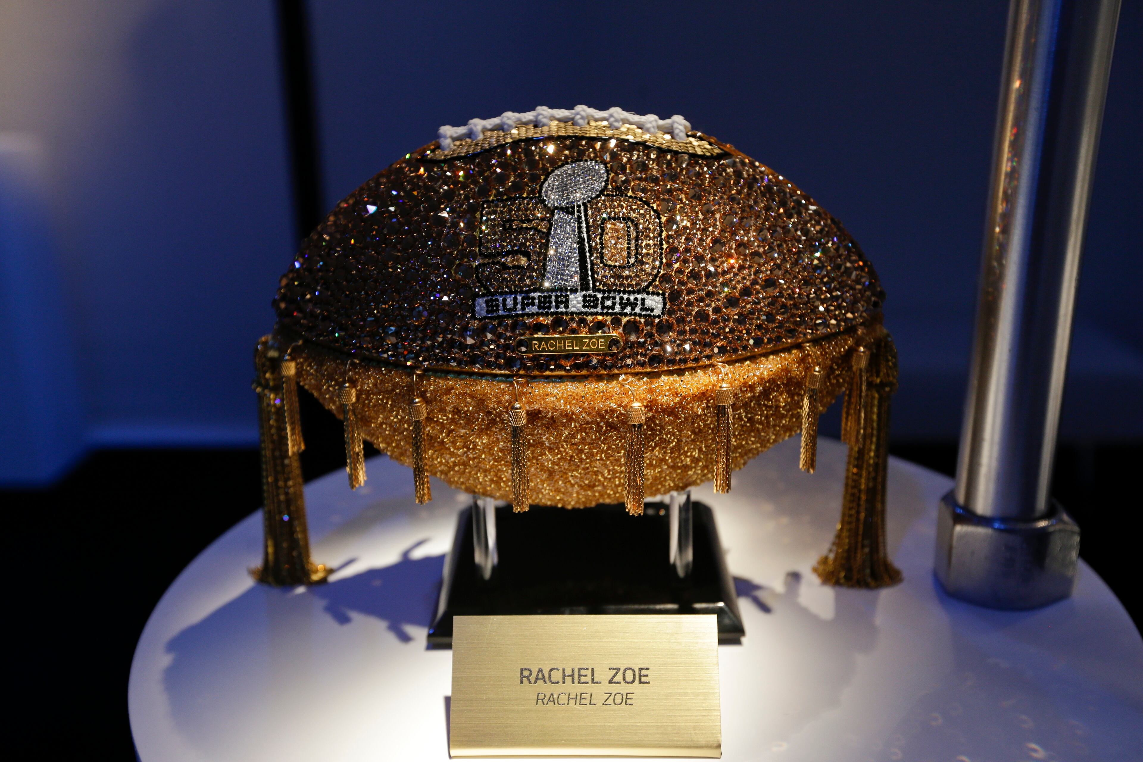 A Rachel Zoe designed football is displayed at the unveiling of the CFDA Footballs Wednesday, Jan. 20, 2016, at the NFL headquarters in New York. In celebration of Super Bowl 50 and in support of the NFL Foundation, the NFL and the Council of Fashion Designers of America have collaborated on 50 Bespoke Designer Footballs created by CFDA Members. (AP Photo/Frank Franklin II)
