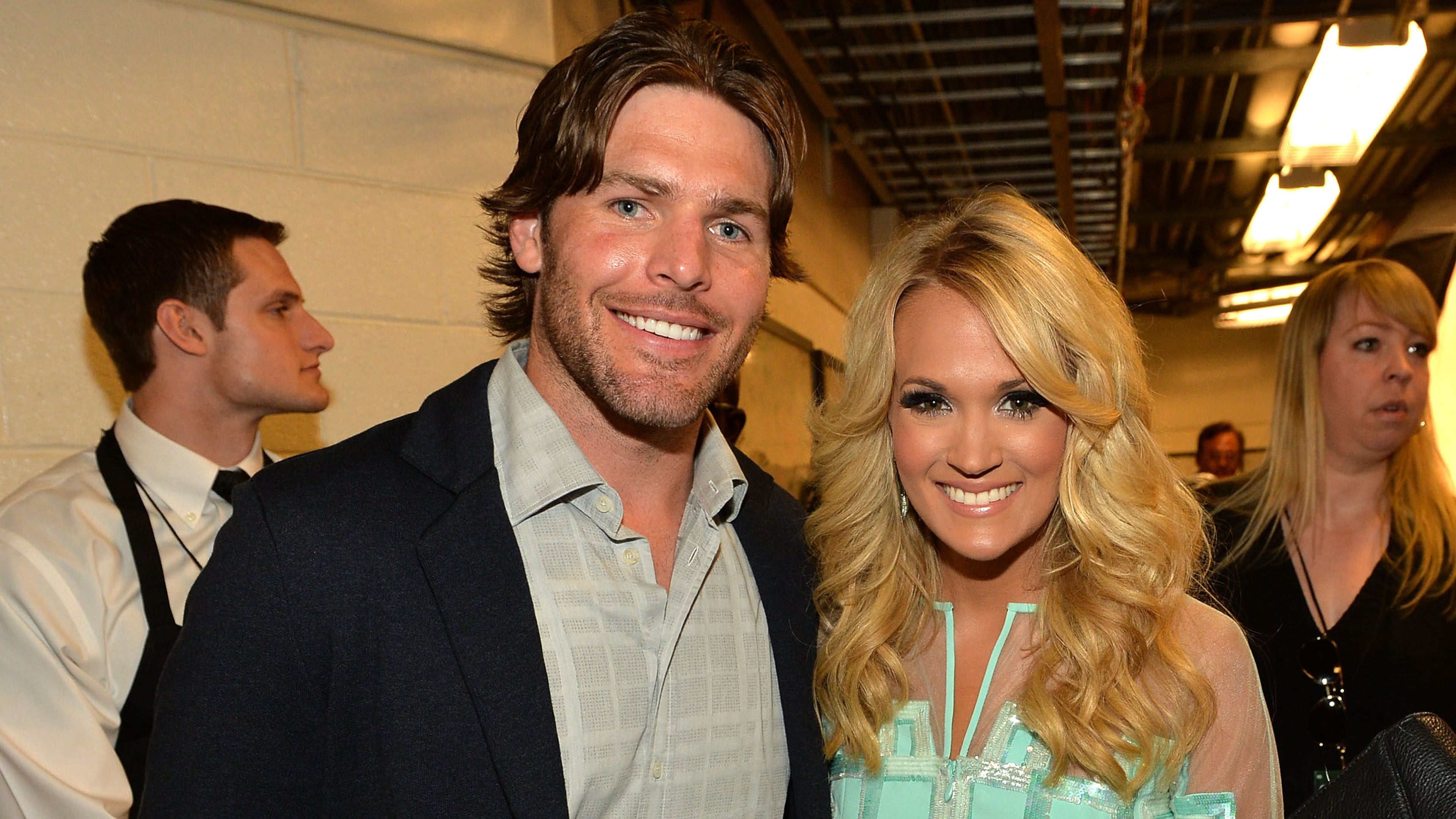 NASHVILLE, TN - JUNE 05: Singer Carrie Underwood (R) and Mike Fisher attend the 2013 CMT Music awards at the Bridgestone Arena on June 5, 2013 in Nashville, Tennessee. (Photo by Rick Diamond/Getty Images)