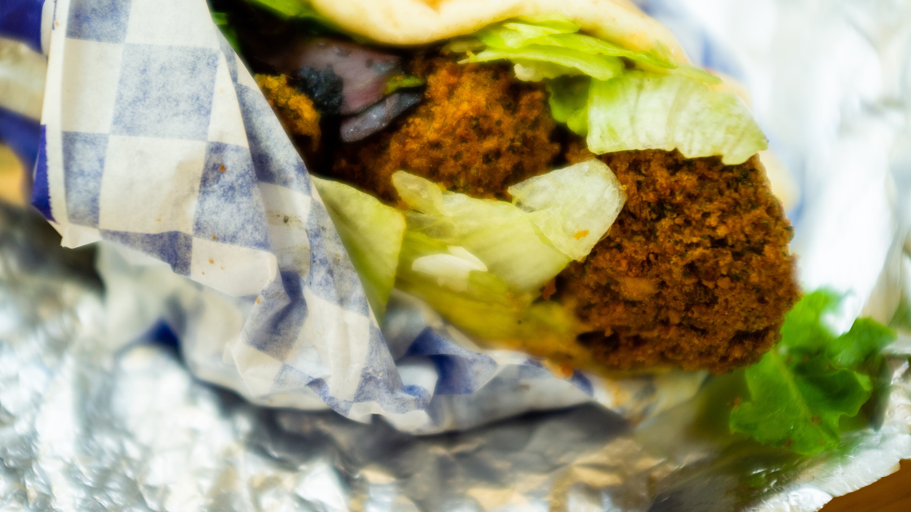The densely-packed falafel wrap at Grecian Gyro will only cost you $6. CONTRIBUTED BY HENRI HOLLIS