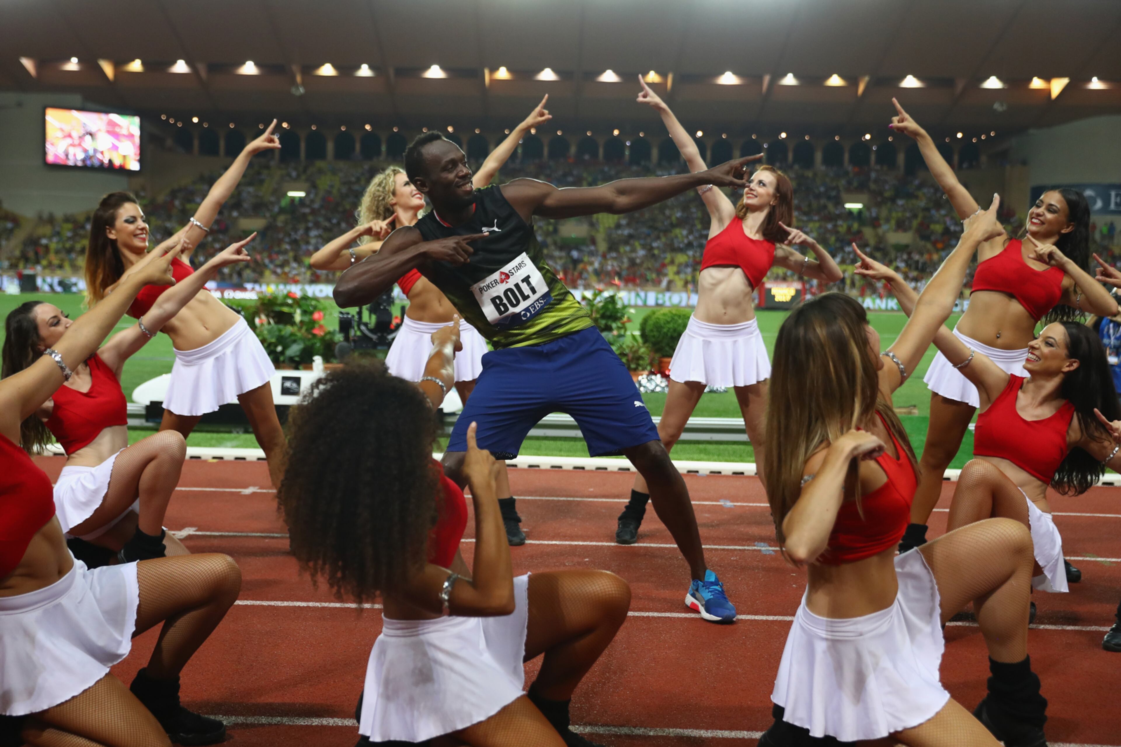 MONACO - JULY 21: Usain Bolt of Jamaica struts his stuff alongside cheerleaders after victory in the men's 100m during the IAAF Diamond League Meeting Herculis on July 21, 2017 in Monaco, Monaco. (Photo by Michael Steele/Getty Images) ***BESTPIX***