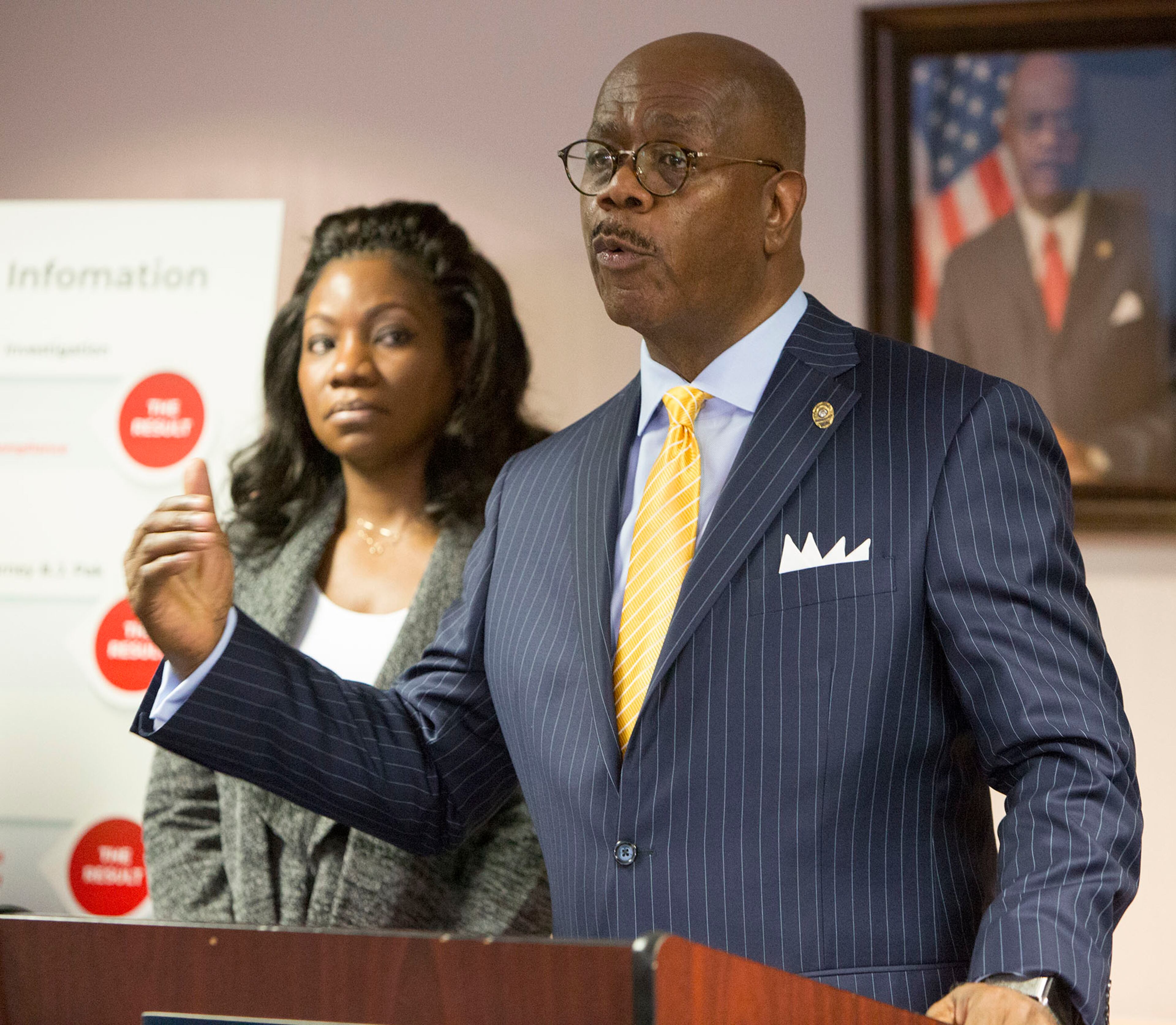Monteria Robinson (left) listens as Fulton County District Attorney Paul L. Howard, Jr., announces the filing of a lawsuit against the United States Department of Justice in the death of her son Jamarion Robinson during a press conference on December 28th, 2018. (Photo by Phil Skinner)