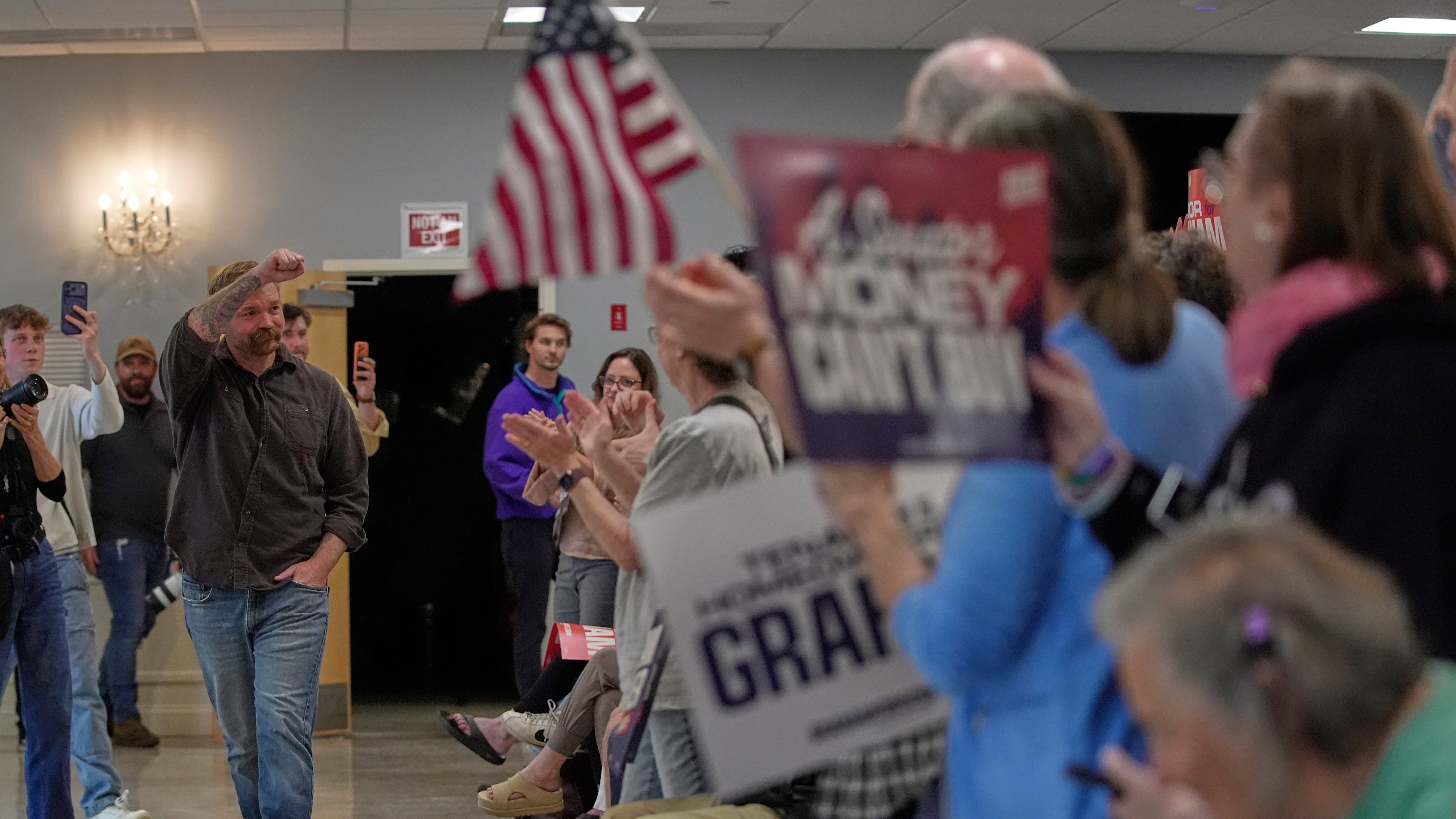 Graham Platner, Democratic candidate for U.S. Senate, acknowledges applause at a campaign event Sunday, June 7, 2026, in Portland, Maine. (AP Photo/Robert F. Bukaty)