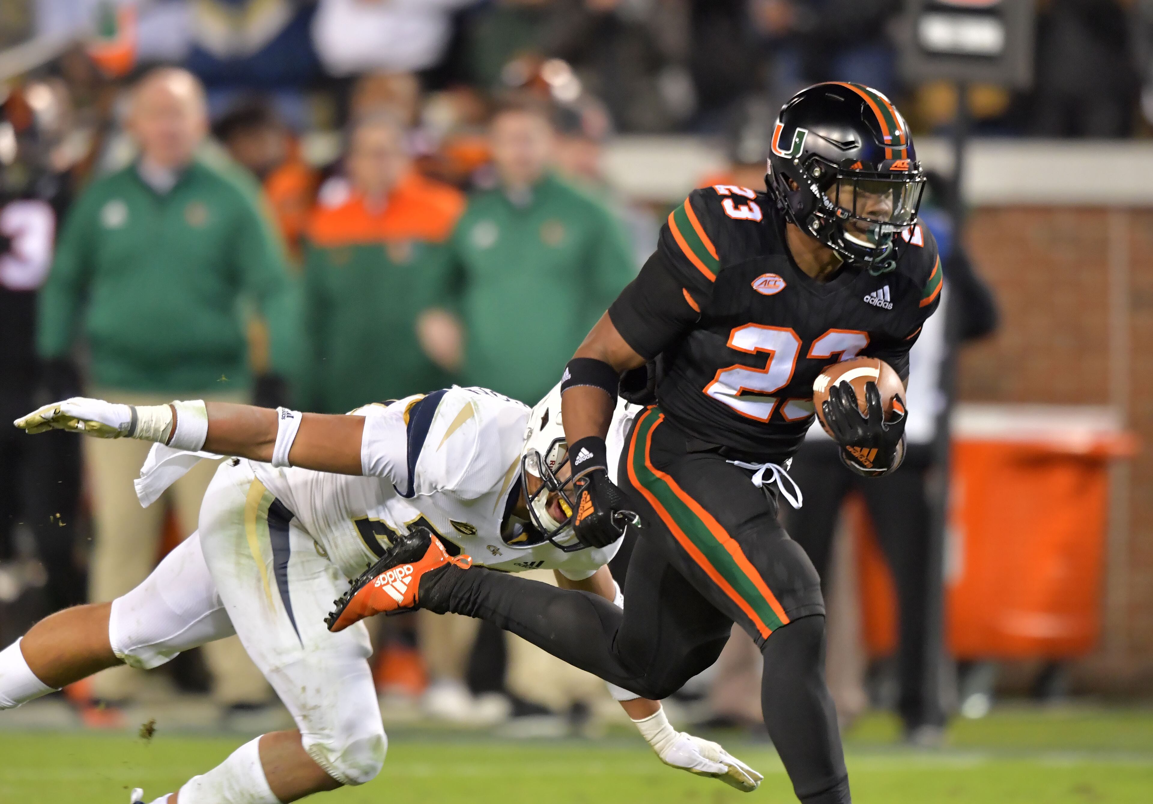 November 10, 2018 Atlanta - Miami running back Cam'Ron Davis (23) runs past Georgia Tech defensive back Jalen Johnson (23) for a touchdown in the first half at Bobby Dodd Stadium on Saturday, November 10, 2018. HYOSUB SHIN / HSHIN@AJC.COM