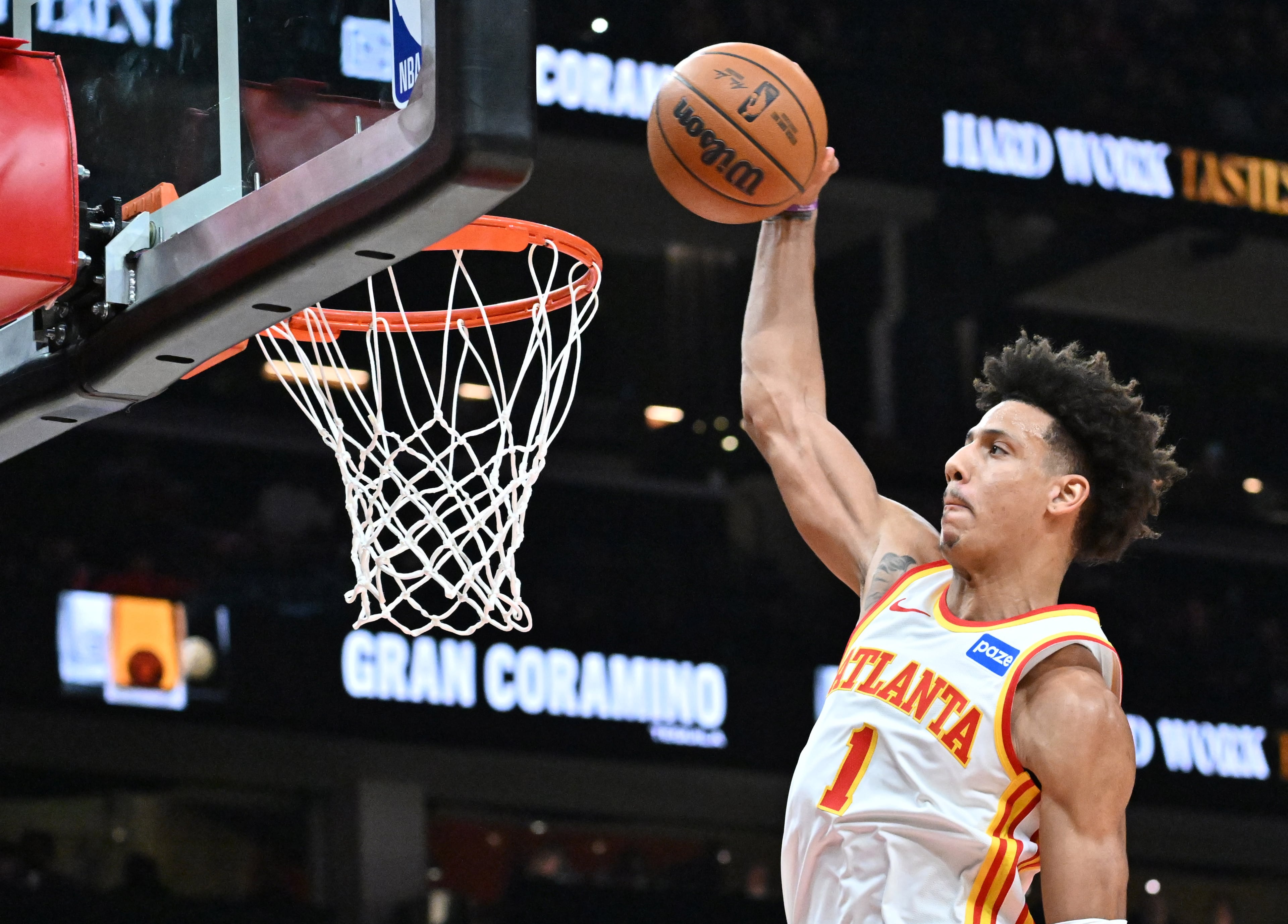 Atlanta Hawks forward Jalen Johnson (1) goes to the basket for dunking the ball during the first half in an NBA basketball game at State Farm Arena, Wednesday, Jan. 7, 2026, in Atlanta. (Hyosub Shin/AJC)