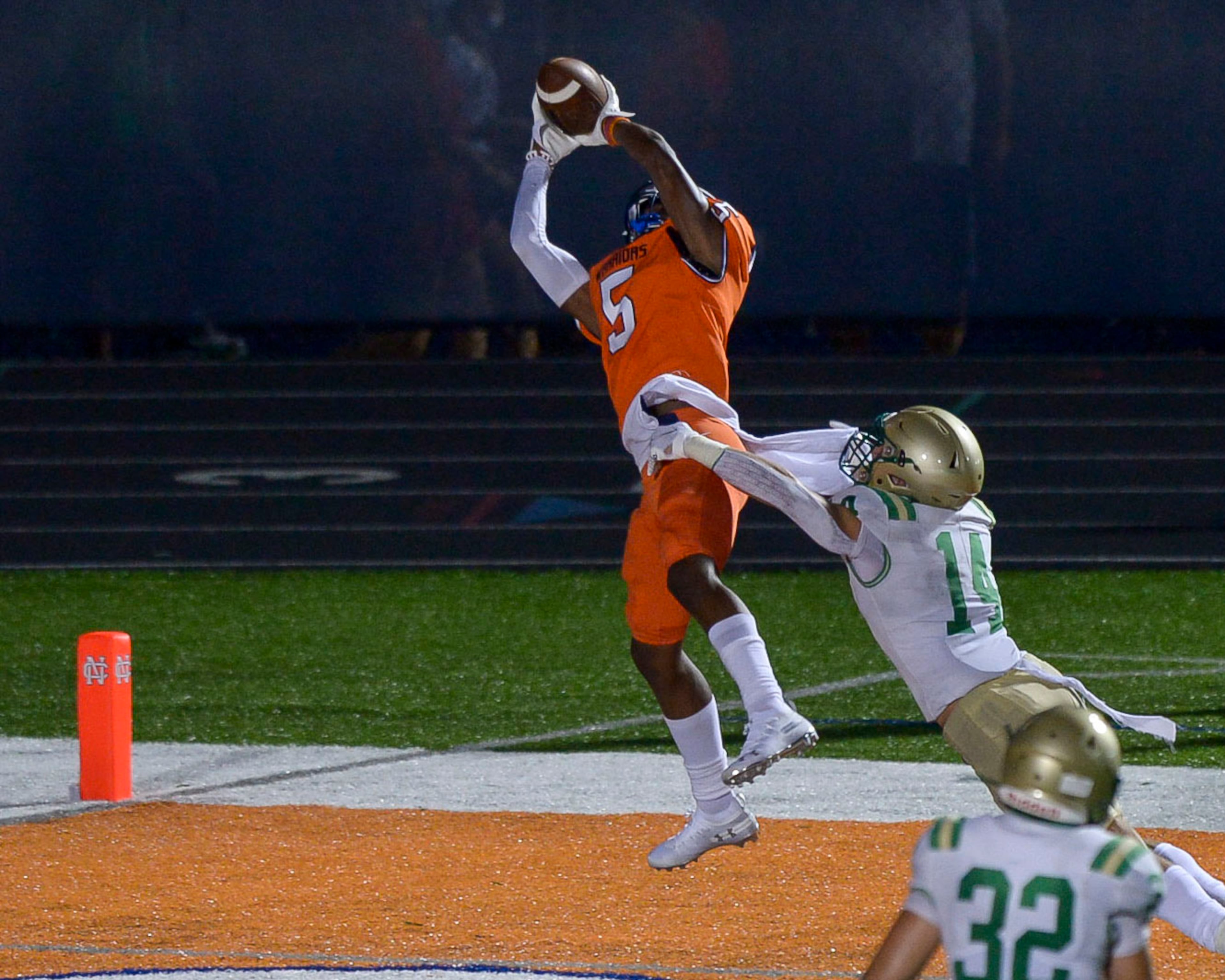 North Cobb wide receiver Christian Moss (5) hauls in a pass against Buford defensive back Jake Pope (14) for a touchdown in the first half Sept 11, 2020, in Kennesaw. (Daniel Varnado/For the AJC)