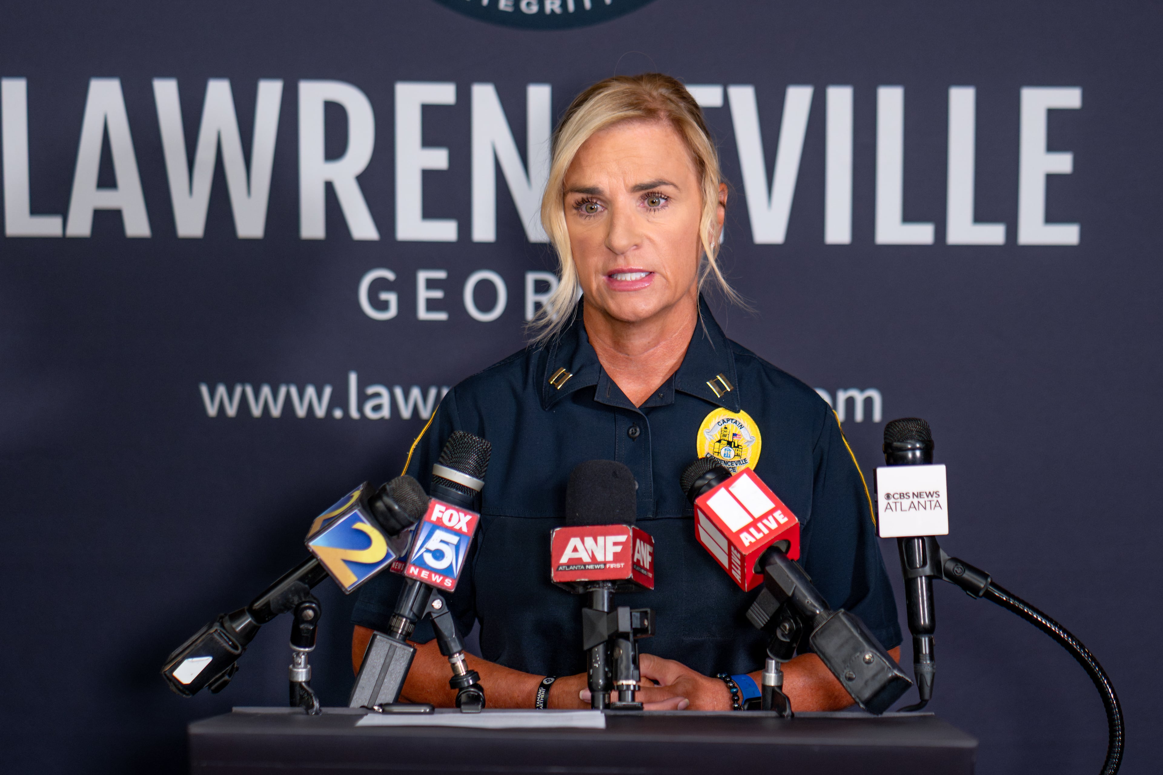 Lawrenceville police spokesperson Capt. Dena Pauly speaks to reporters on Thursday, July 30, 2026, about the death of a 1-year-old boy who police said was left in a hot car the day before. (Ben Hendren for the AJC)