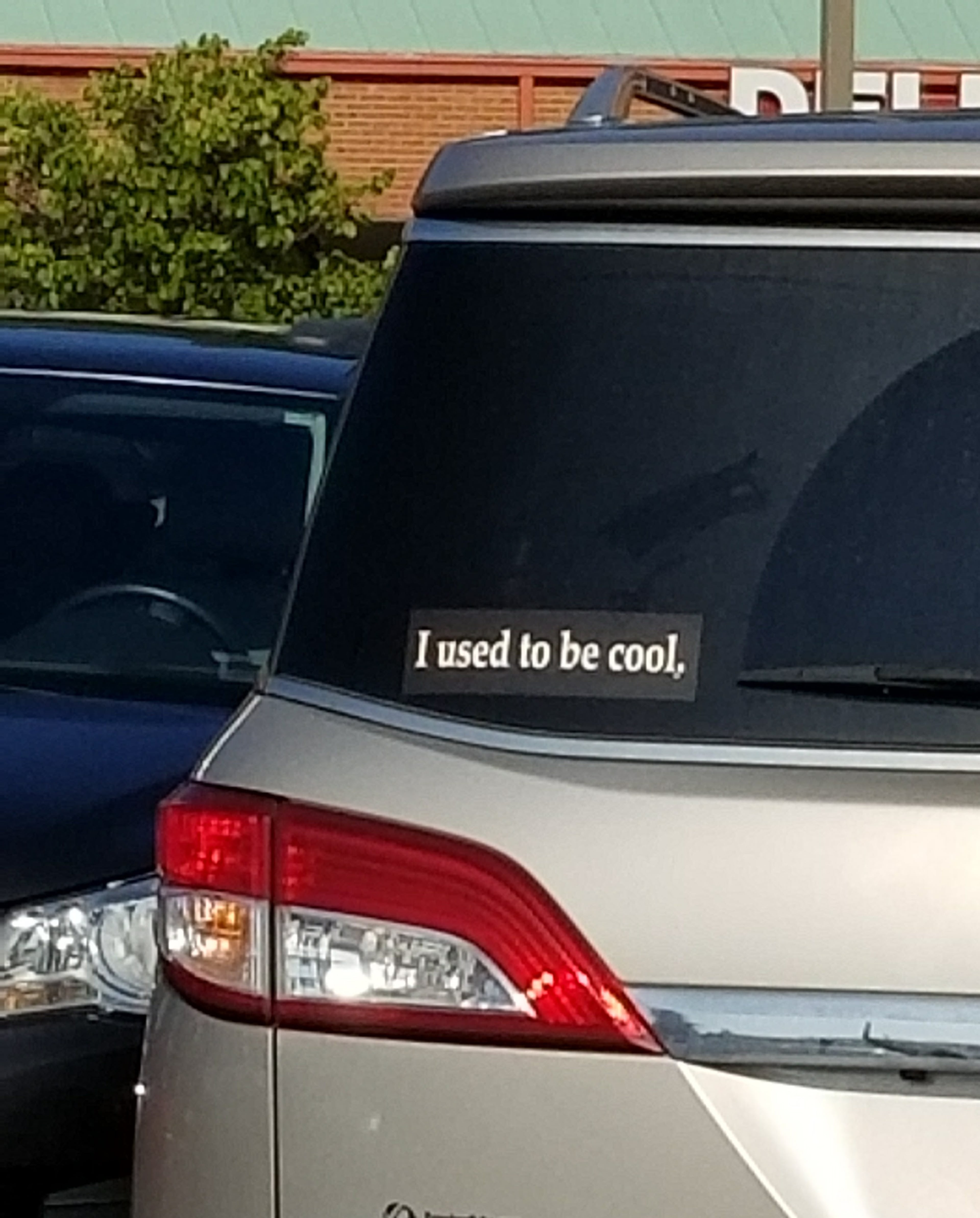 A bumper sticker on a minivan. (Chris Hardesty/Cox Automotive)