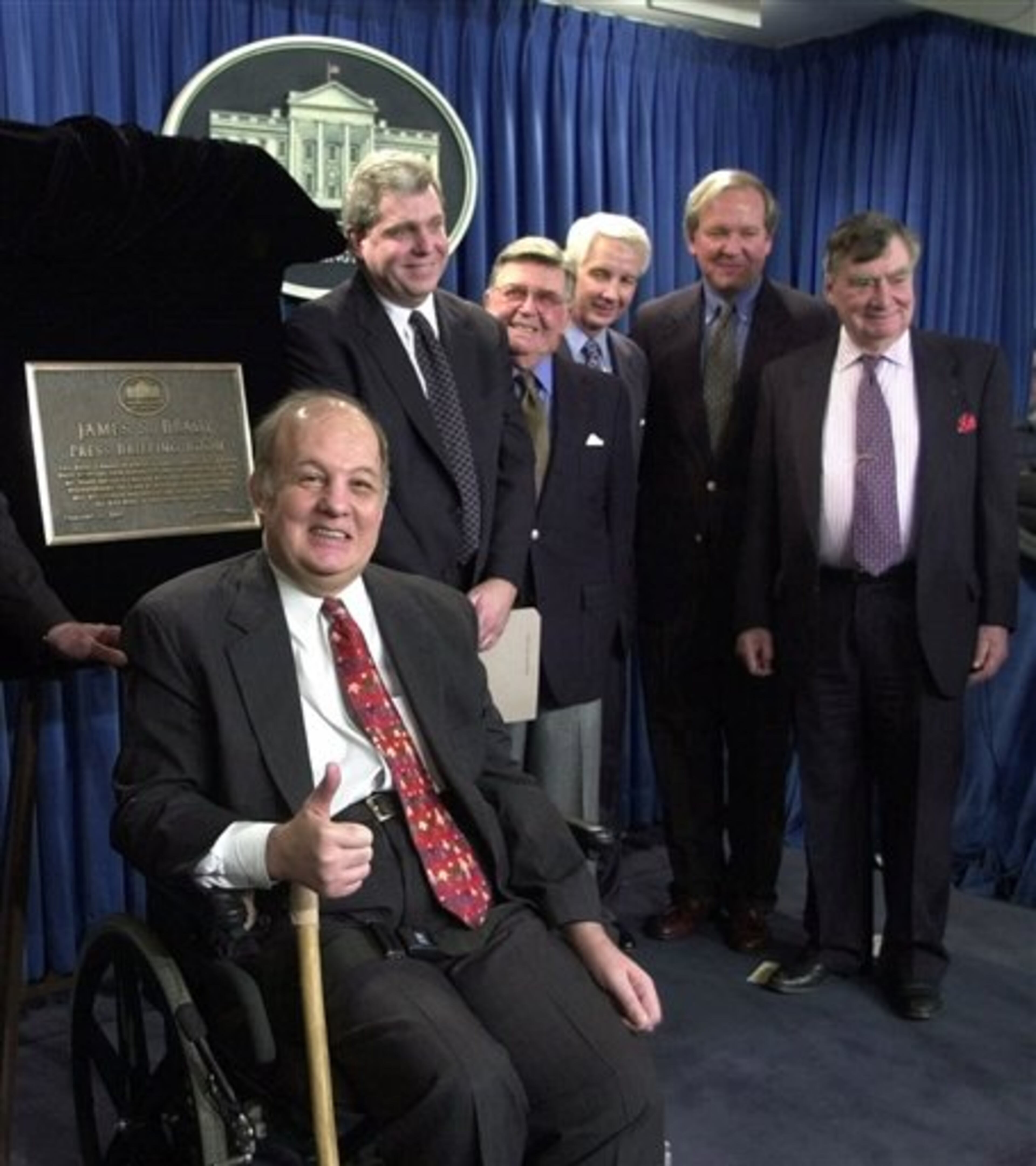 FILE - This Feb. 11, 2000 file photo shows former White House press secretary for President Reagan James Brady, left, in a group photo following a dedication ceremony for the new James S. Brady Press Briefing Room at the White House in Washington. From left are, Brady, presidential press secretaries Joe Lockhart (Clinton), Jerald terHorst (Ford), Larry Speakes (Reagan), Mike McCurry (Clinton) and Pierre Salinger (Kennedy). A Brady family spokeswoman says Brady has died at 73. (AP Photo/Susan Walsh/File)