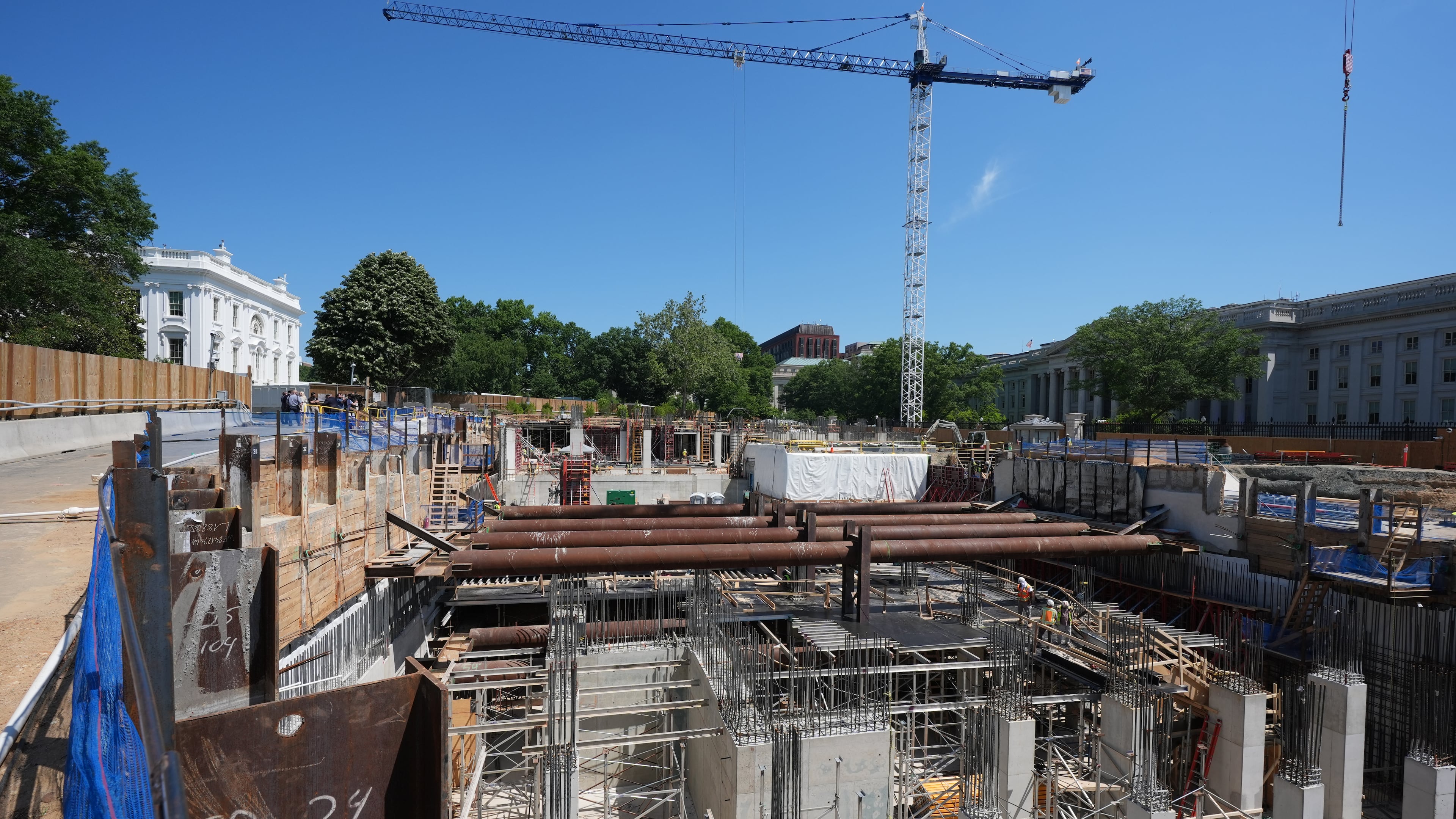 The Ballroom construction site can be seen as President Donald Trump tours the area at the White House, Tuesday, May 19, 2026, in Washington. (AP Photo/Jacquelyn Martin)