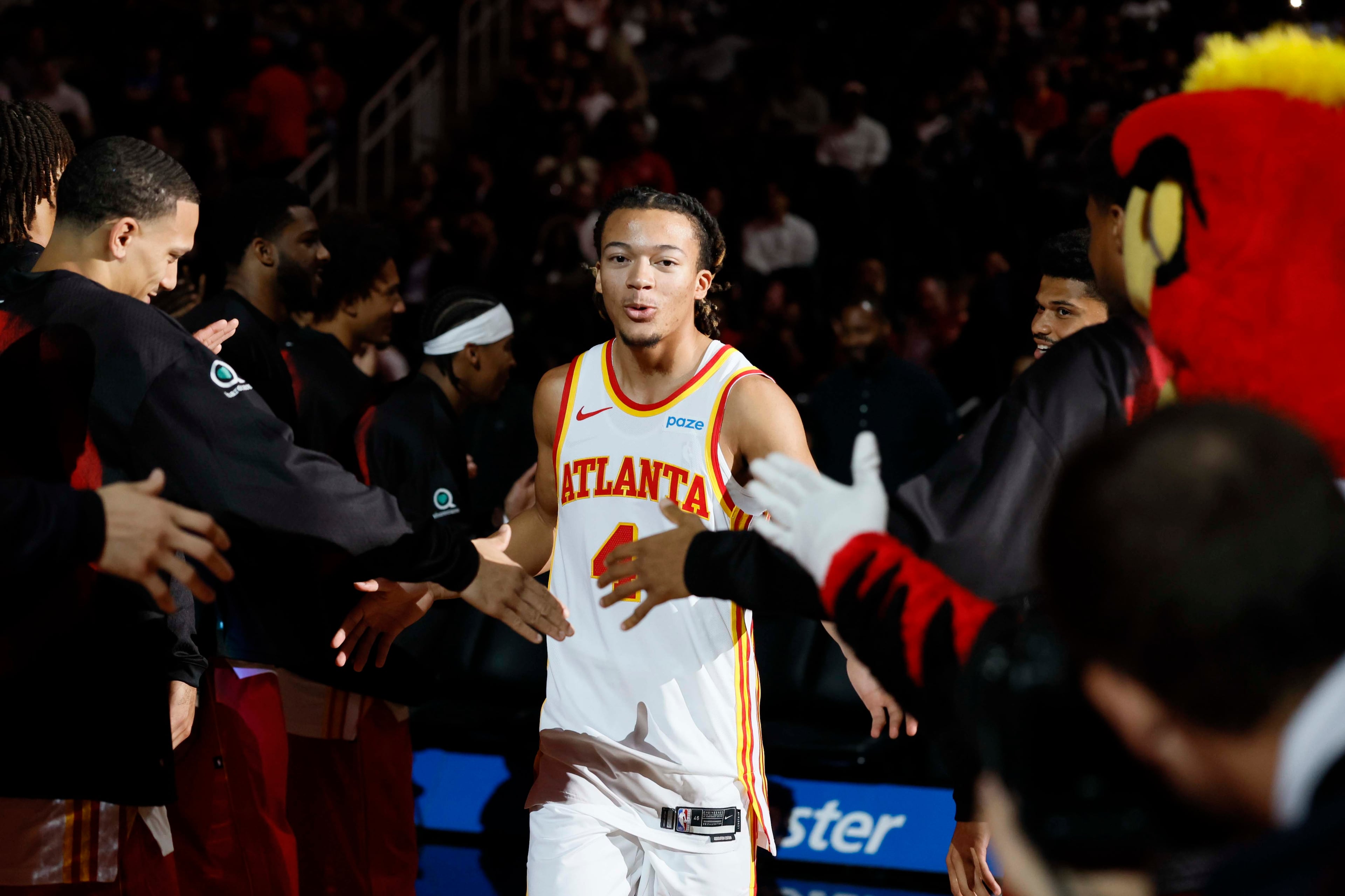 Atlanta Hawks guard Kingston Flemings is greeted by teammates as he is being introduced before the preseason game between the Memphis Grizzlies and the Atlanta Hawks at State Farm Arena in Atlanta on Monday, Oct. 5, 2026. (Miguel Martinez/AJC)