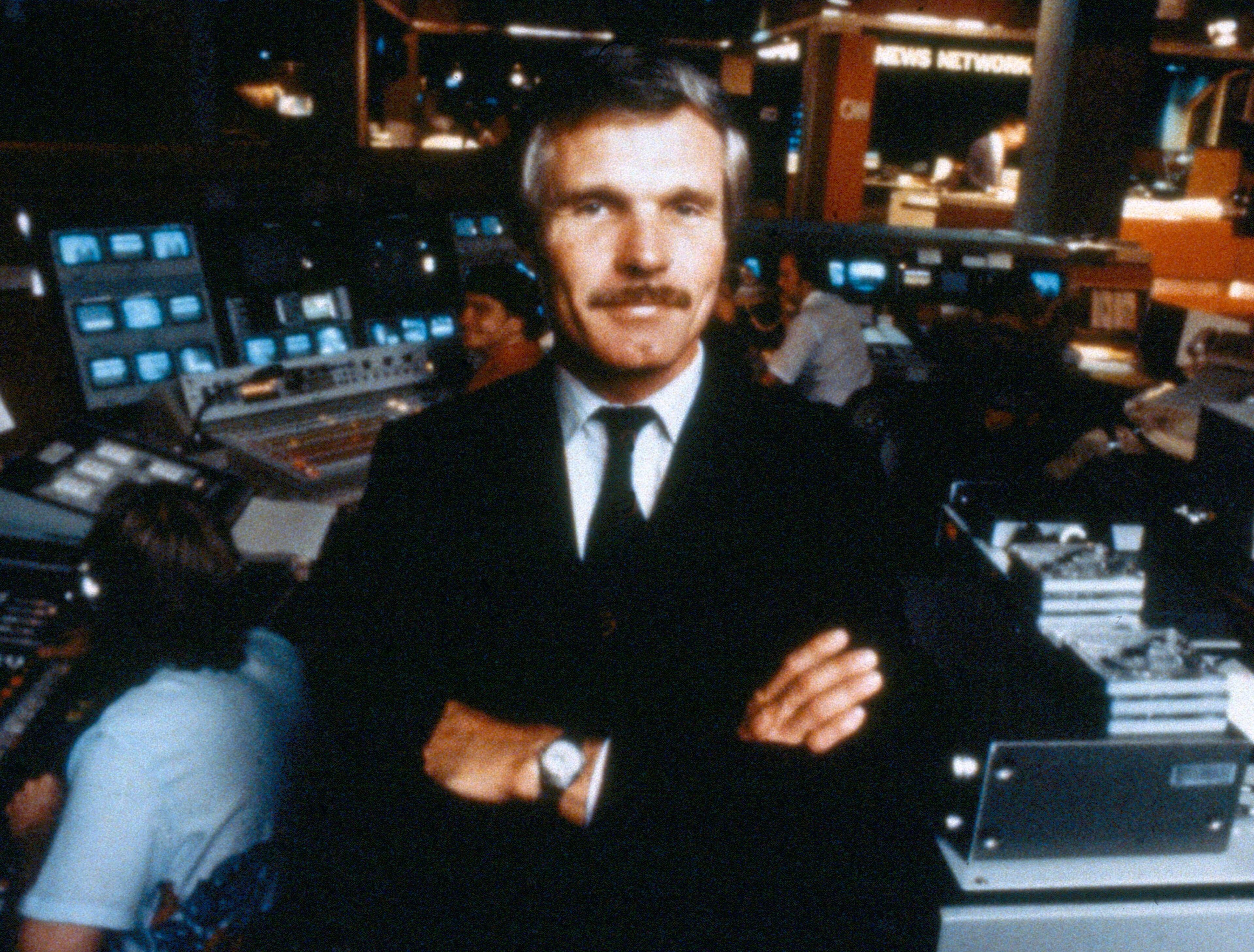 Turner, seen here in the CNN studios in 1985, continued to build his cable-broadcasting empire through the 1980s. His bid to buy the CBS network fell through, but soon afterwards he purchased the MGM/UA studio in 1986. However, that deal cost him too much, and Turner ended up owning only the studio's pre-1986 film and television library. Controversially, he colorized black-and-white classics like "Casablanca," to much ridicule. (AP file)