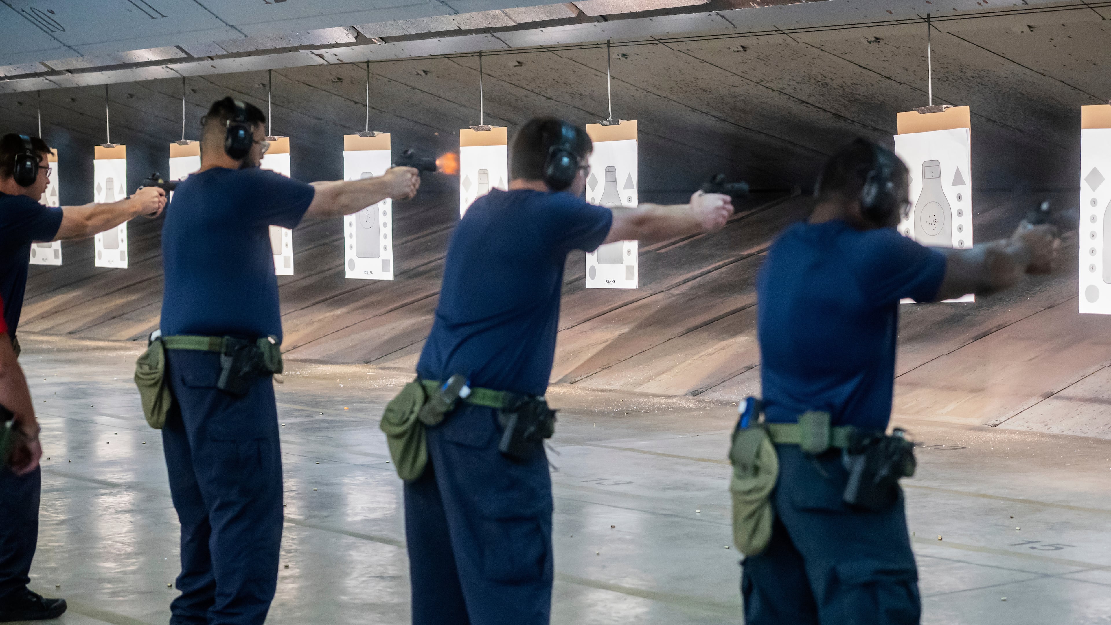 FILE - Immigration and Customs Enforcement (ICE) trainees practice shooting handguns at the indoor firing range at the Federal Law Enforcement Training Centers (FLETC) in Brunswick, Ga., Aug. 21, 2025. (AP Photo/Fran Ruchalski, File)