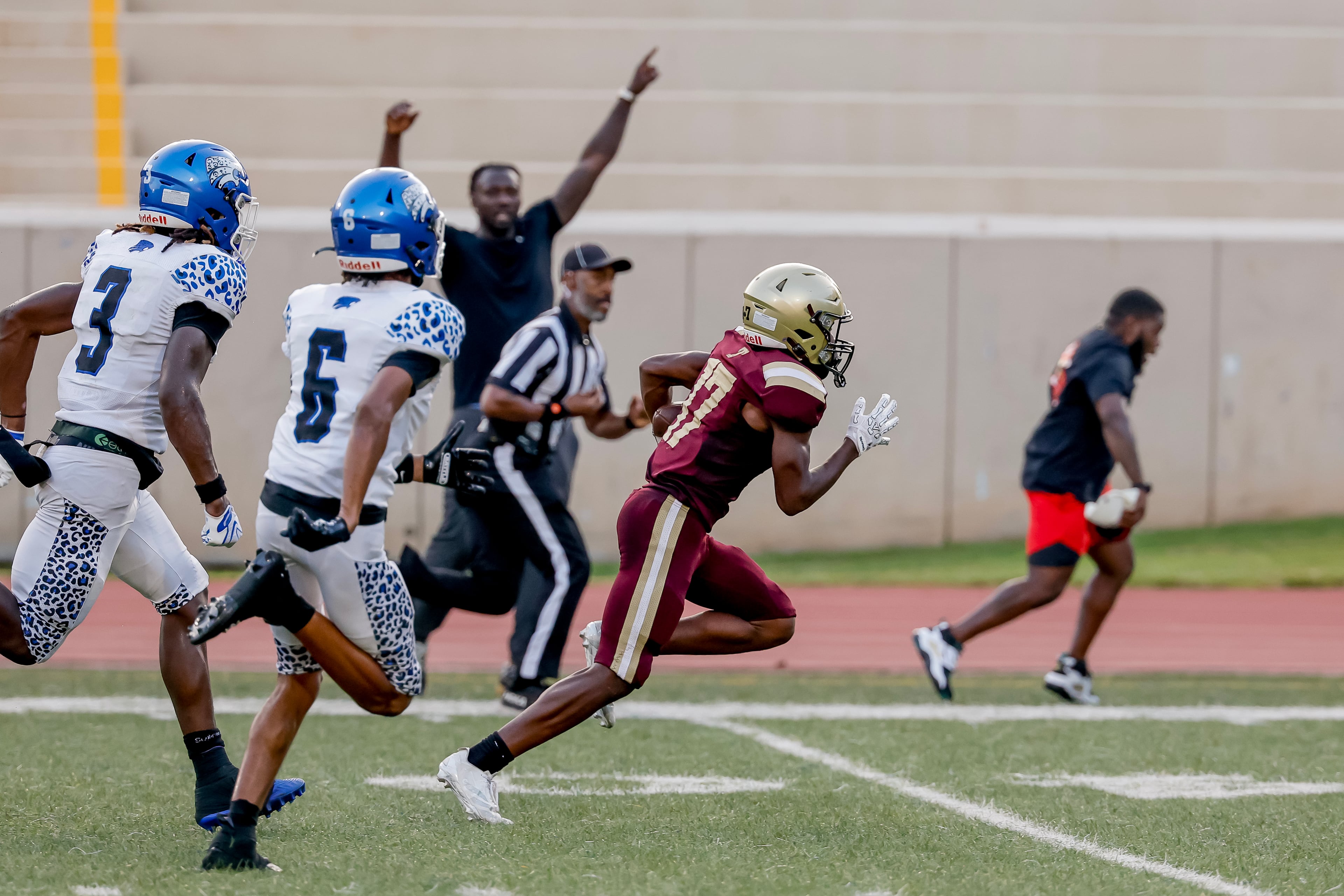 Tucker’s Jerron Guiden (right) makes a long third-down reception against Stephenson defenders Terrence Woodfin (left) and Josiah Ashmon at Hallford Stadium on Friday, Sept. 4, 2026, in Clarkston. (Erik S. Lesser for the AJC)