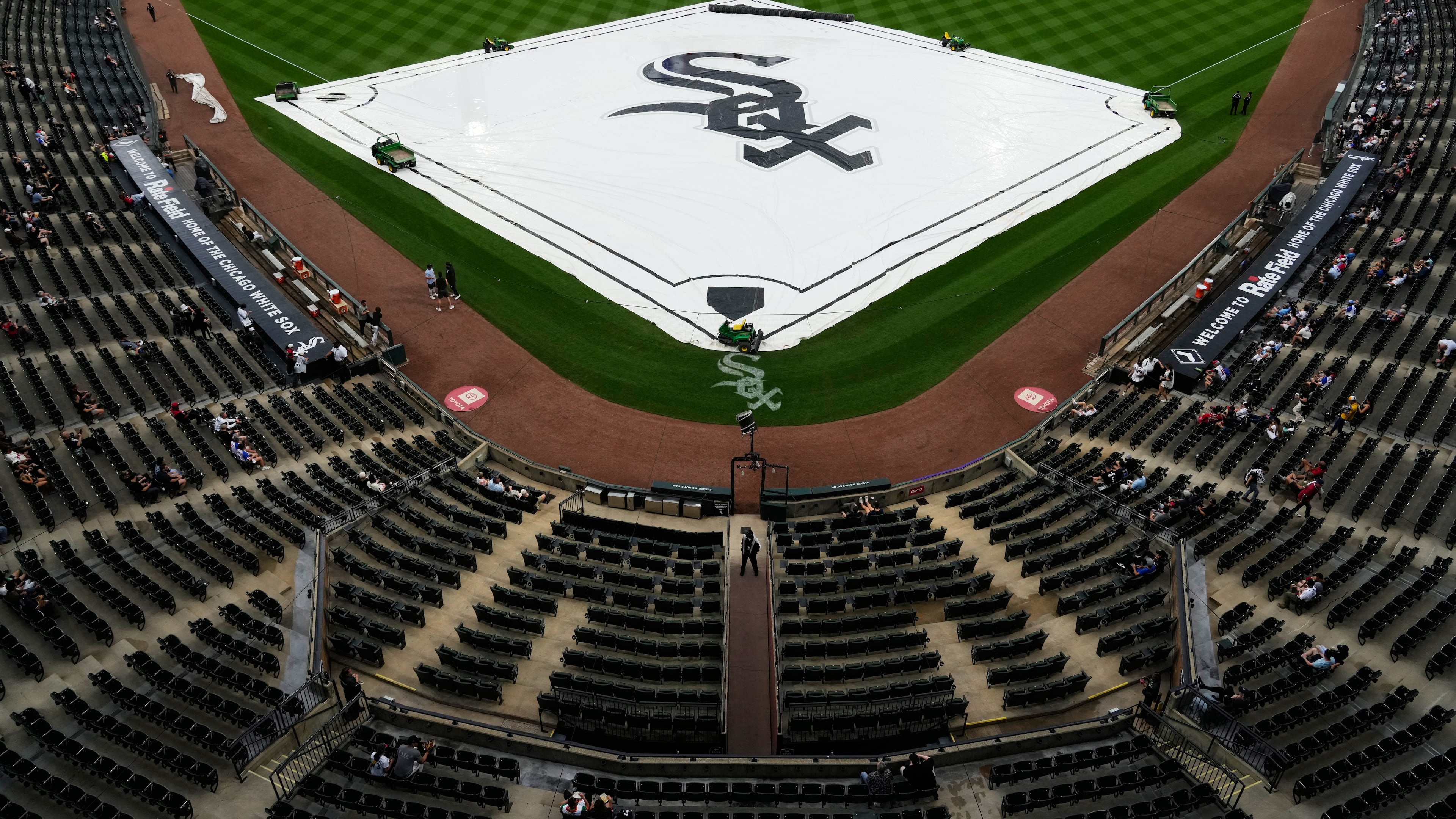 A tarp covers the infield during a rain delay before a baseball game between the Atlanta Braves and the Chicago White Sox in Chicago, Thursday, June 11, 2026. (AP Photo/Nam Y. Huh)