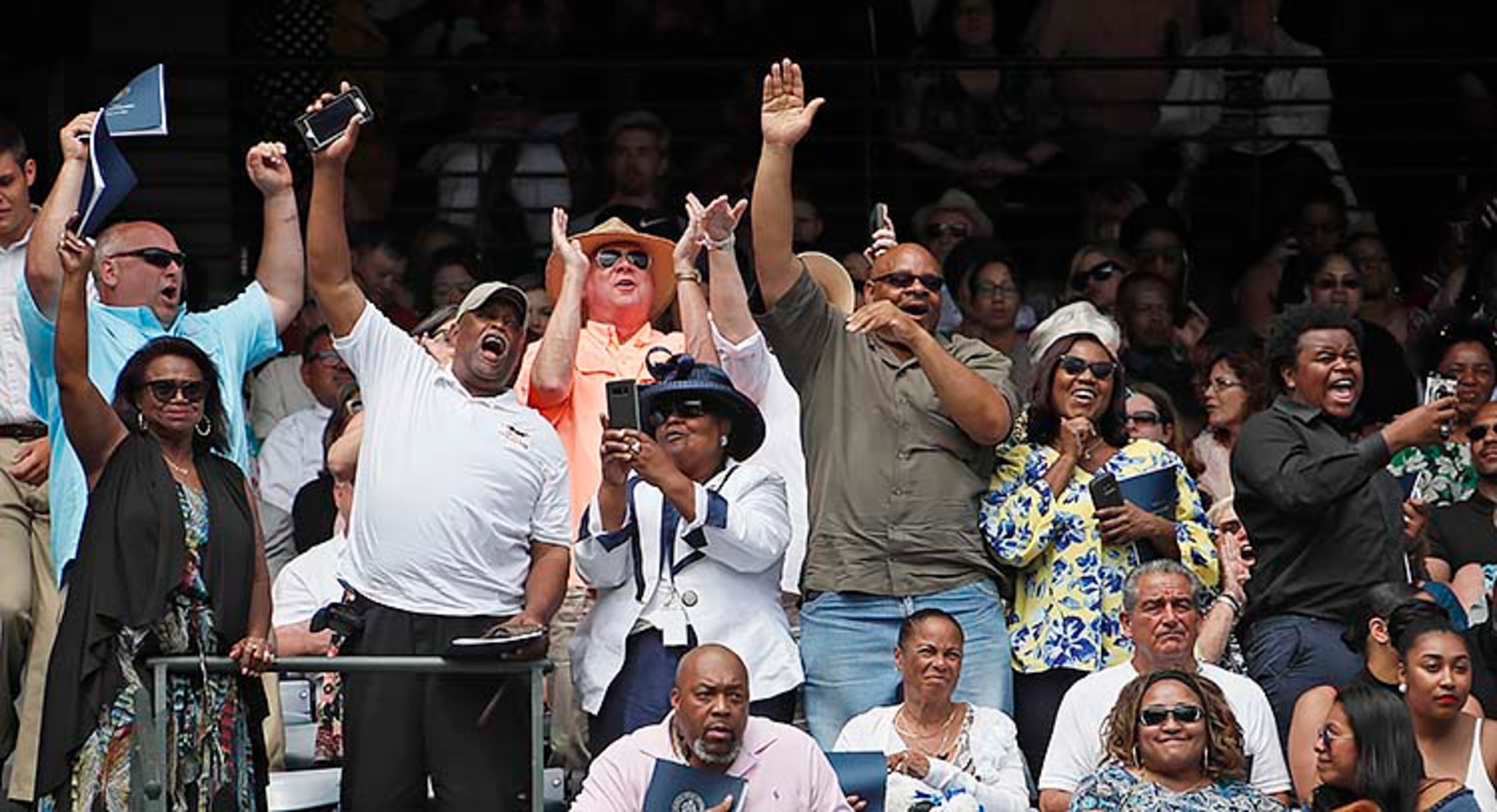 May 9, 2019 - Atlanta - Family members cheer for their graduate as their name is called to take the stage. Georgia State University is hosting its 104th Commencement Monday, May 6 through Tuesday, May 14 at Panther Stadium in Atlanta. Six schools held their graduation on Thursday. Bob Andres / bandres@ajc.com