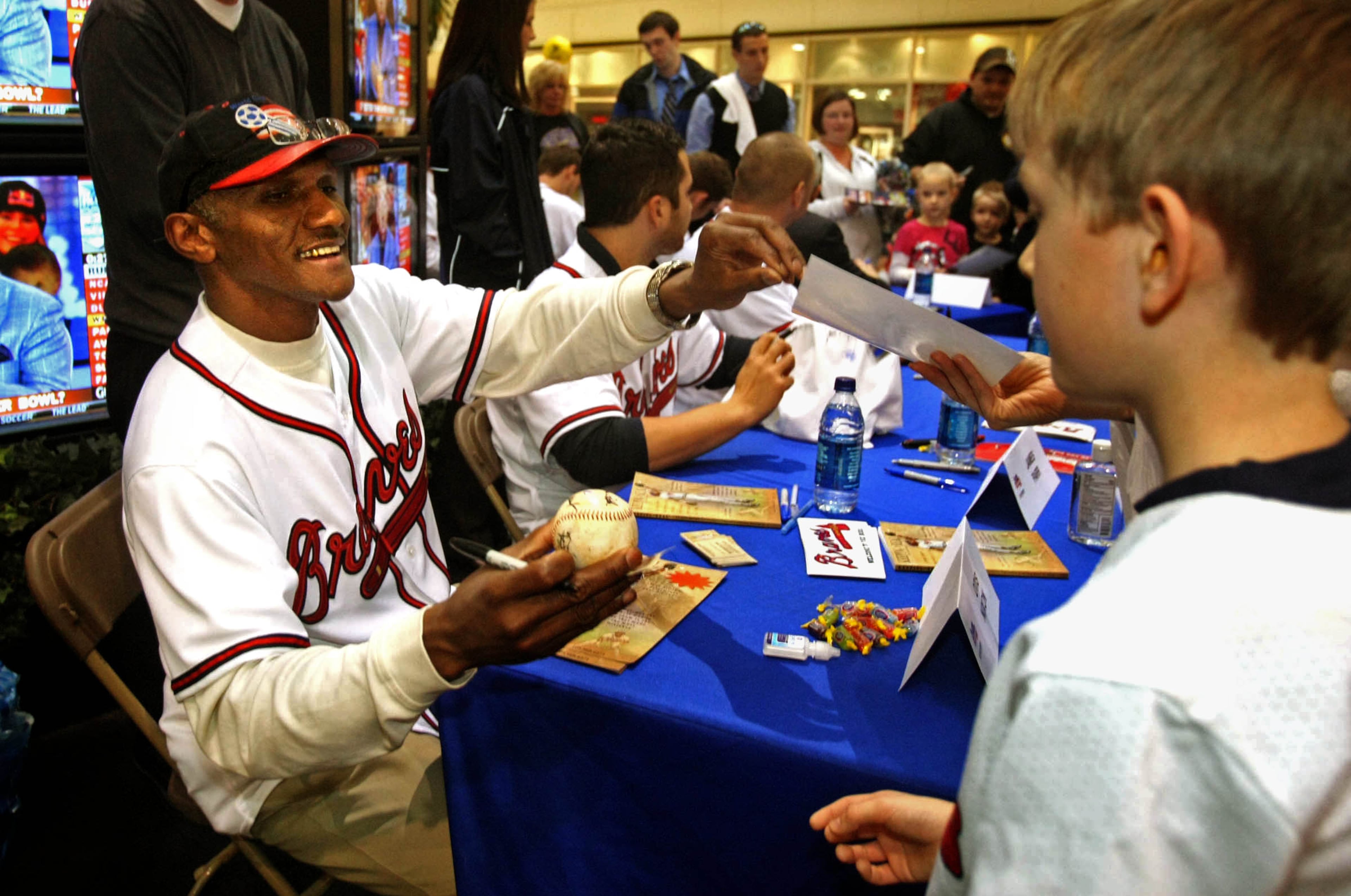 Feb. 9, 2010: Nixon signs autographs for fans as he and other Braves visit them during a pre-season caravan at Hamilton Place Mall in Chattanooga, Tenn.