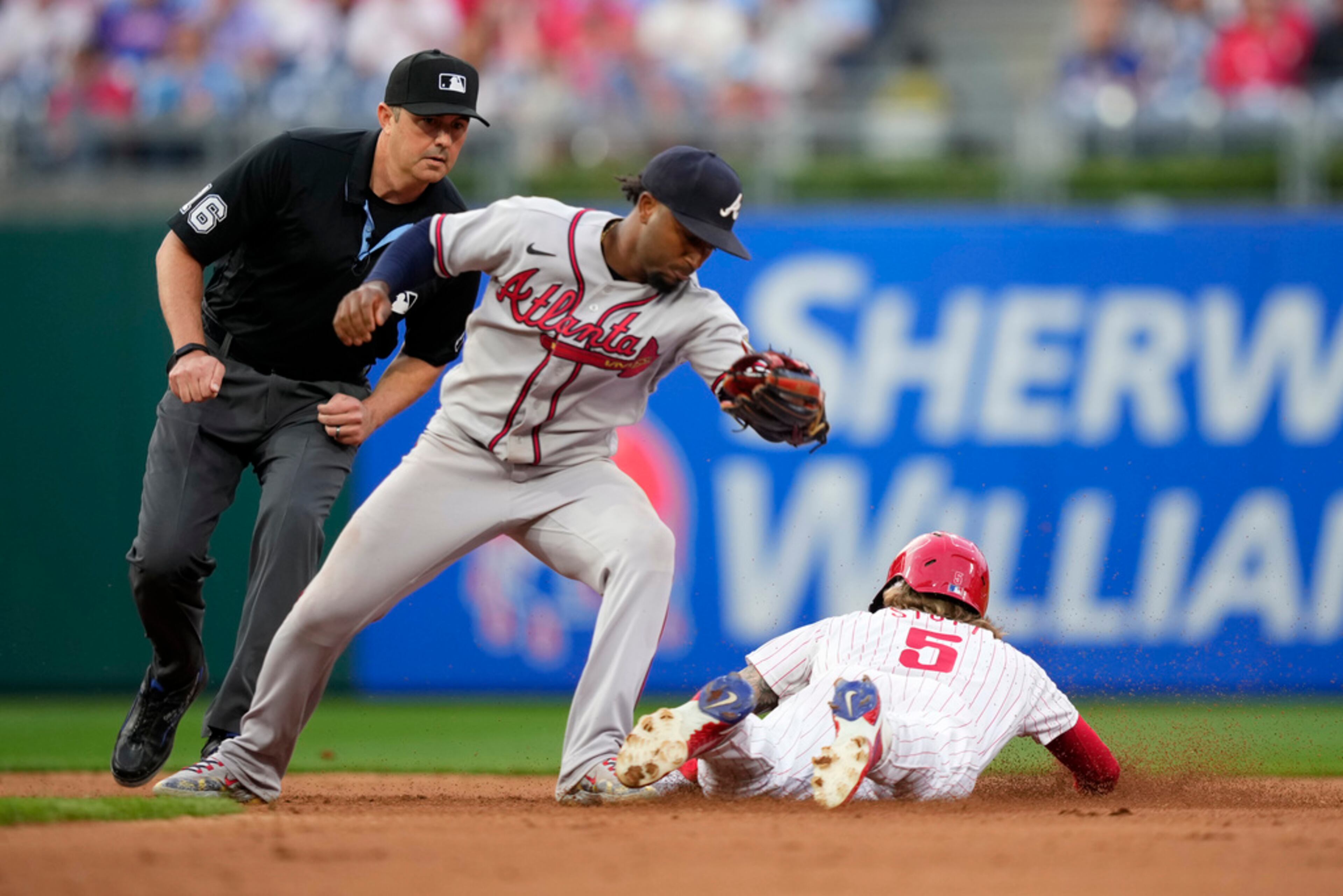 Philadelphia Phillies' Bryson Stott, right, steals second past Atlanta Braves second baseman Ozzie Albies during the fourth inning of a baseball game, Tuesday, June 20, 2023, in Philadelphia. (AP Photo/Matt Slocum)