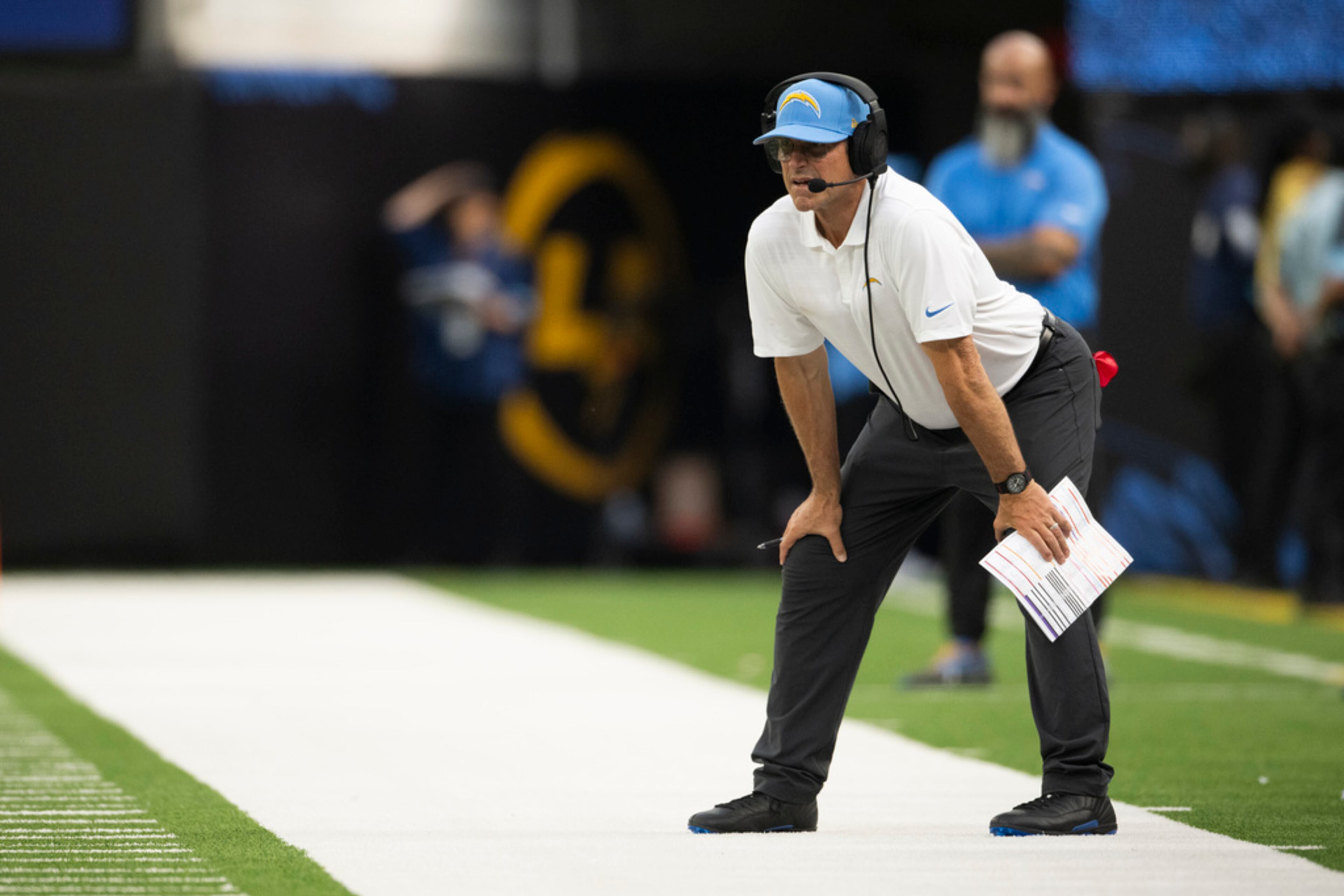 Los Angeles Chargers head coach Jim Harbaugh watches his players during an NFL preseason football game against the Los Angeles Rams, Saturday, Aug. 17, 2024, in Inglewood, Calif. (AP Photo/Kyusung Gong)