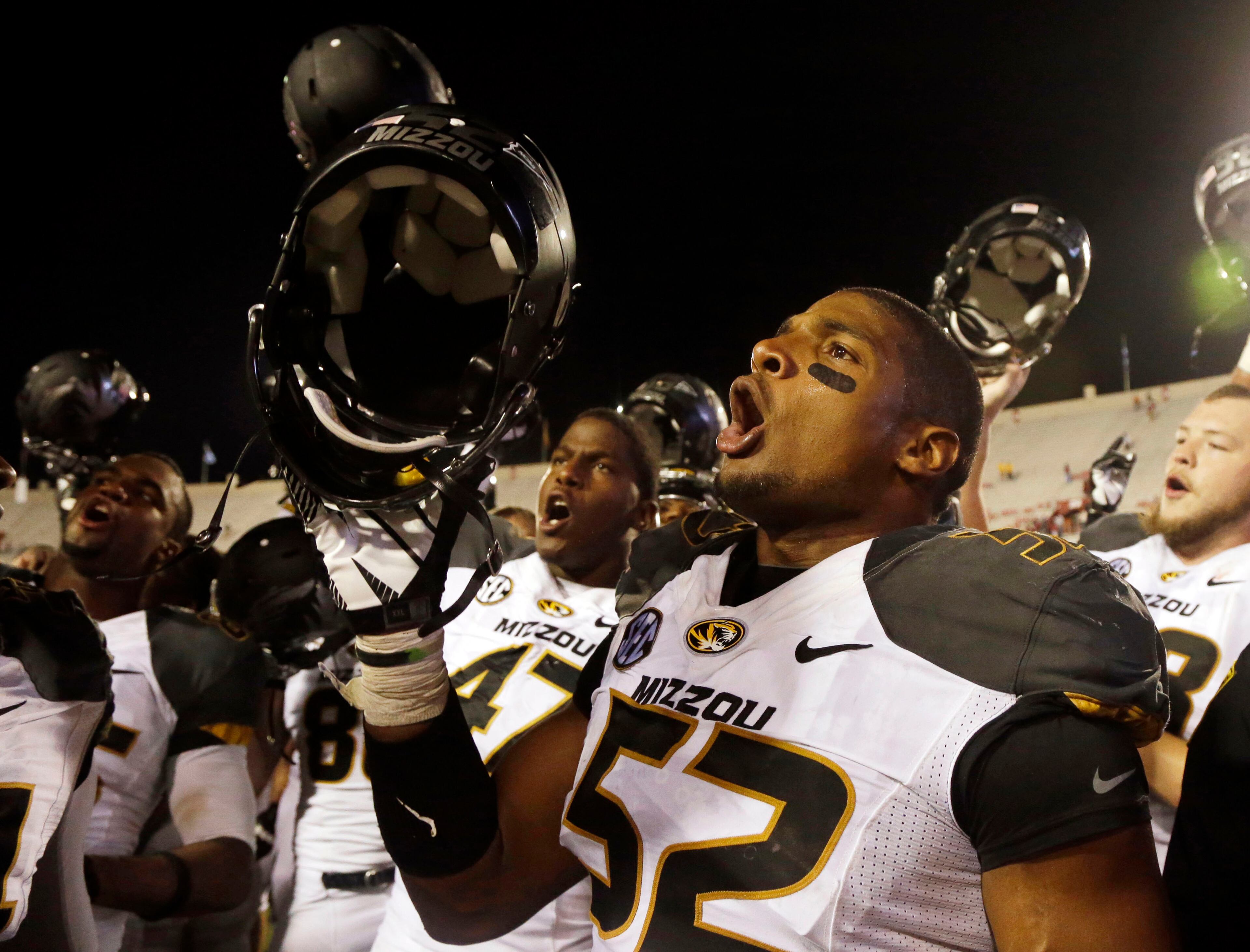 Missouri's Michael Sam (52) sings the school song after Missouri defeated Indiana.