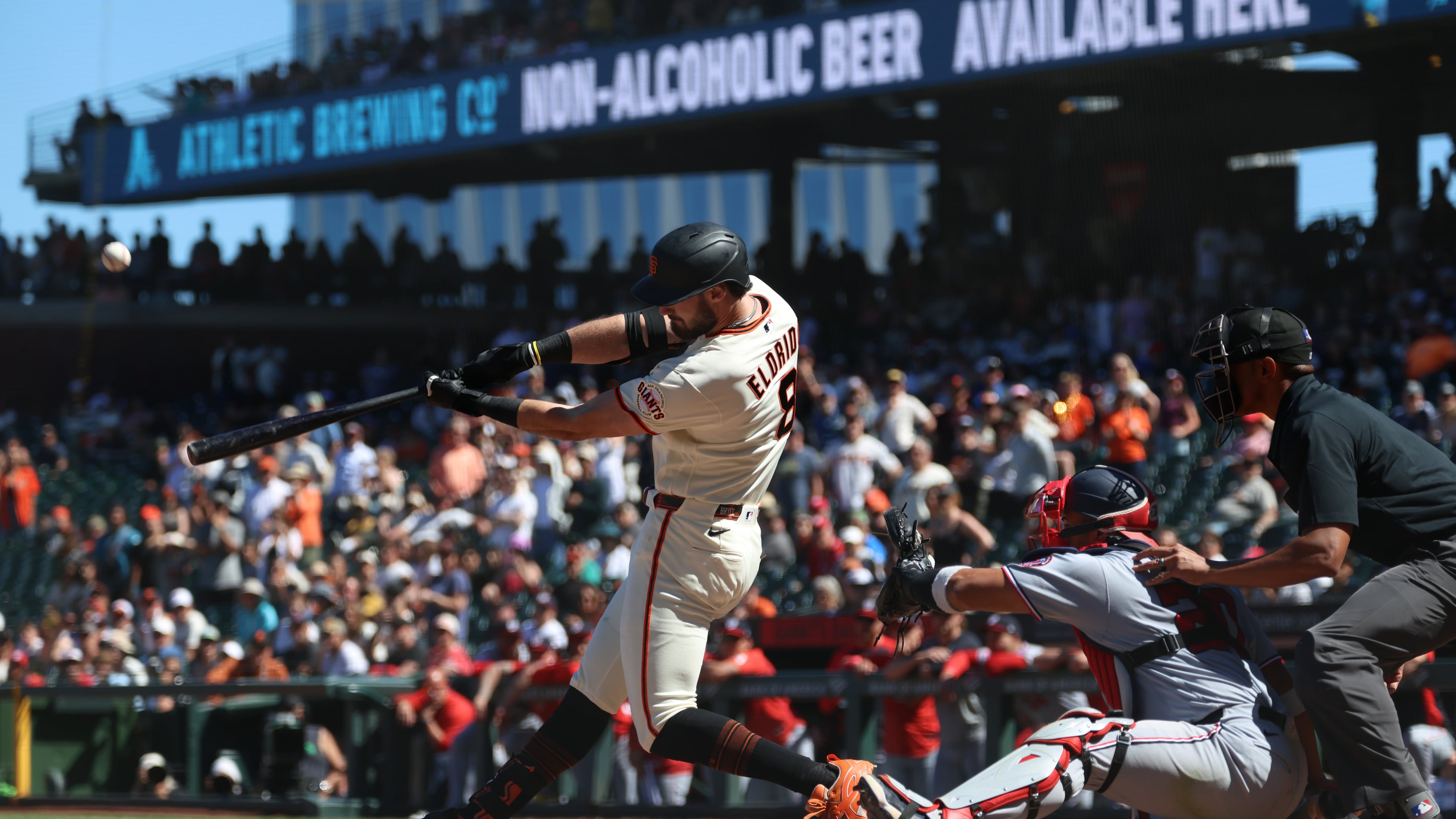 San Francisco Giants' Bryce Eldridge hits a grand slam in front of Washington Nationals catcher Keibert Ruiz during the ninth inning of a baseball game in San Francisco, Wednesday, June 10, 2026. (AP Photo/Jed Jacobsohn)