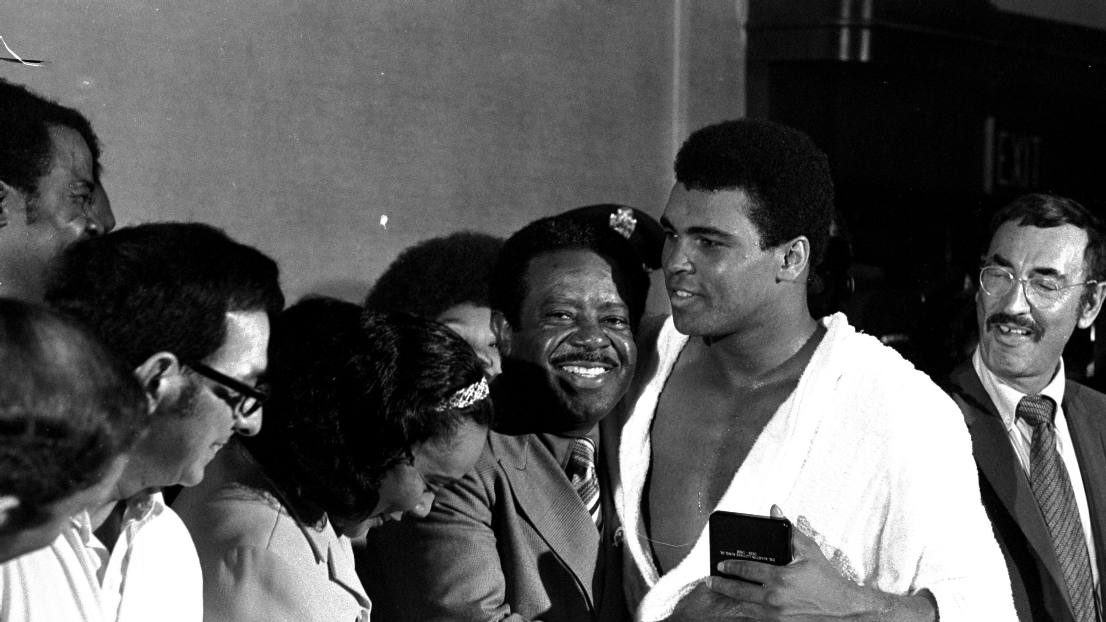 Muhammad Ali is congratulated by Dr. Ralph Abernathy and Coretta Scott King after beating Jerry Quarry in Atlanta on Oct. 26, 1970. (AP Photo)
