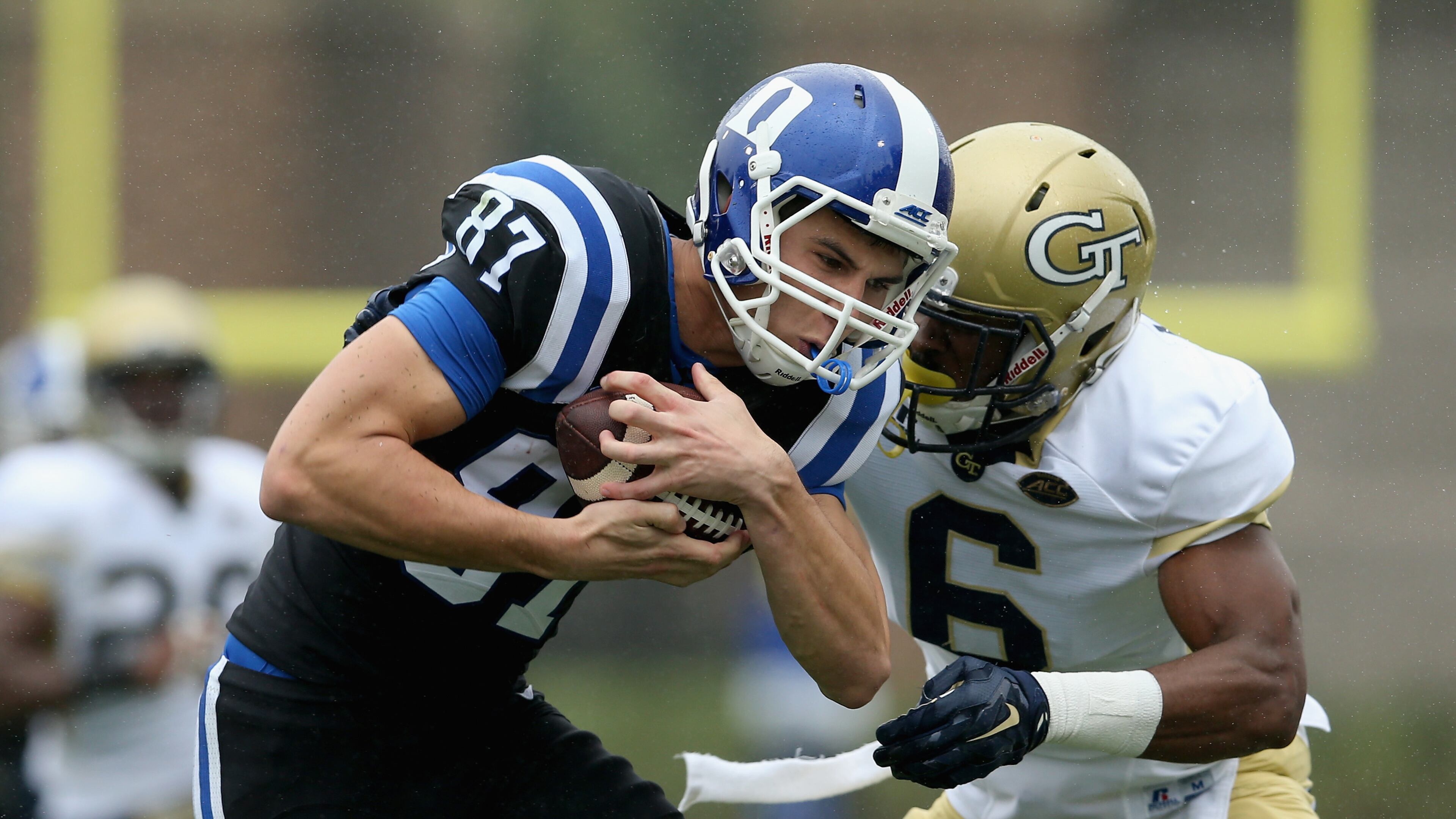 DURHAM, NC - SEPTEMBER 26: Chris Milton #6 of the Georgia Tech Yellow Jackets tries to tackle Max McCaffrey #87 of the Duke Blue Devils during their game at Wallace Wade Stadium on September 26, 2015 in Durham, North Carolina. (Photo by Streeter Lecka/Getty Images)