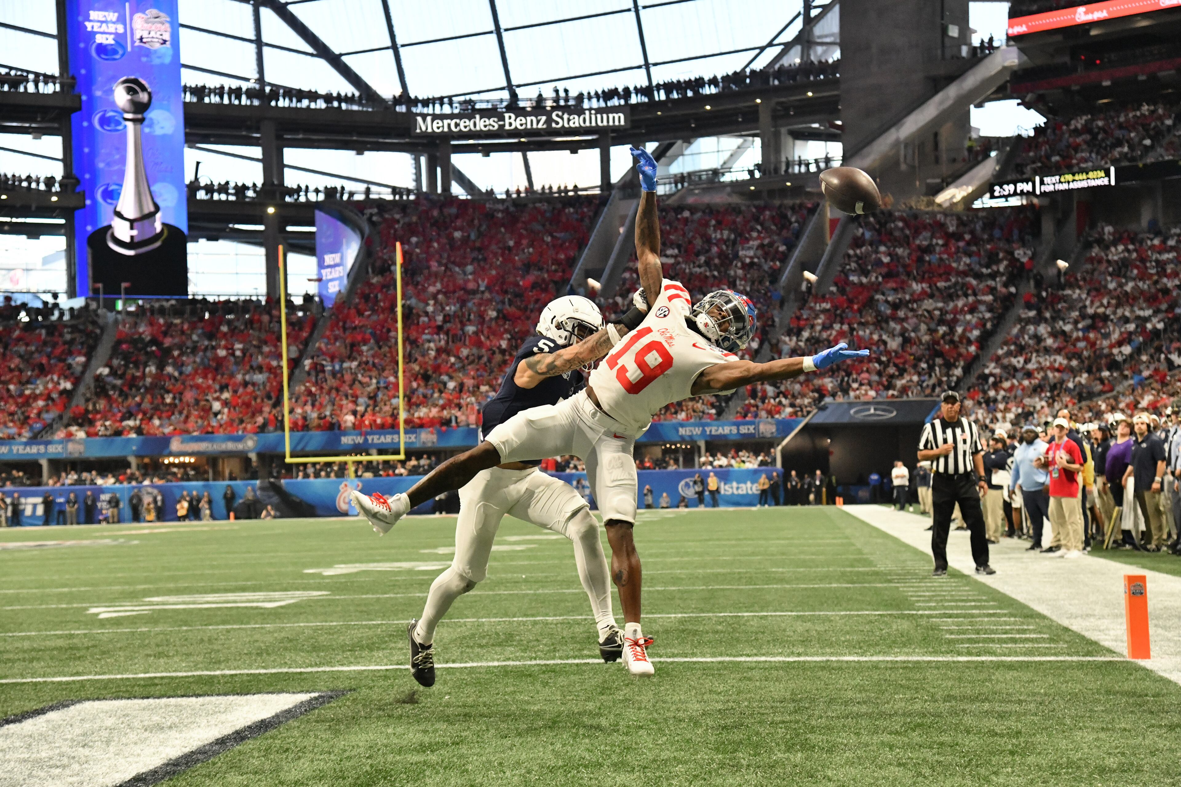 Ole Miss wide receiver Dayton Wade (19) is not able to catch under pressure from Penn State cornerback Cam Miller (5) during the second half in 2023 Chick-fil-A Peach Bowl at Mercedes-Benz Stadium, Saturday, December 30, 2023, in Atlanta. Ole Miss won 38-25 over Penn State. (Hyosub Shin / Hyosub.Shin@ajc.com)