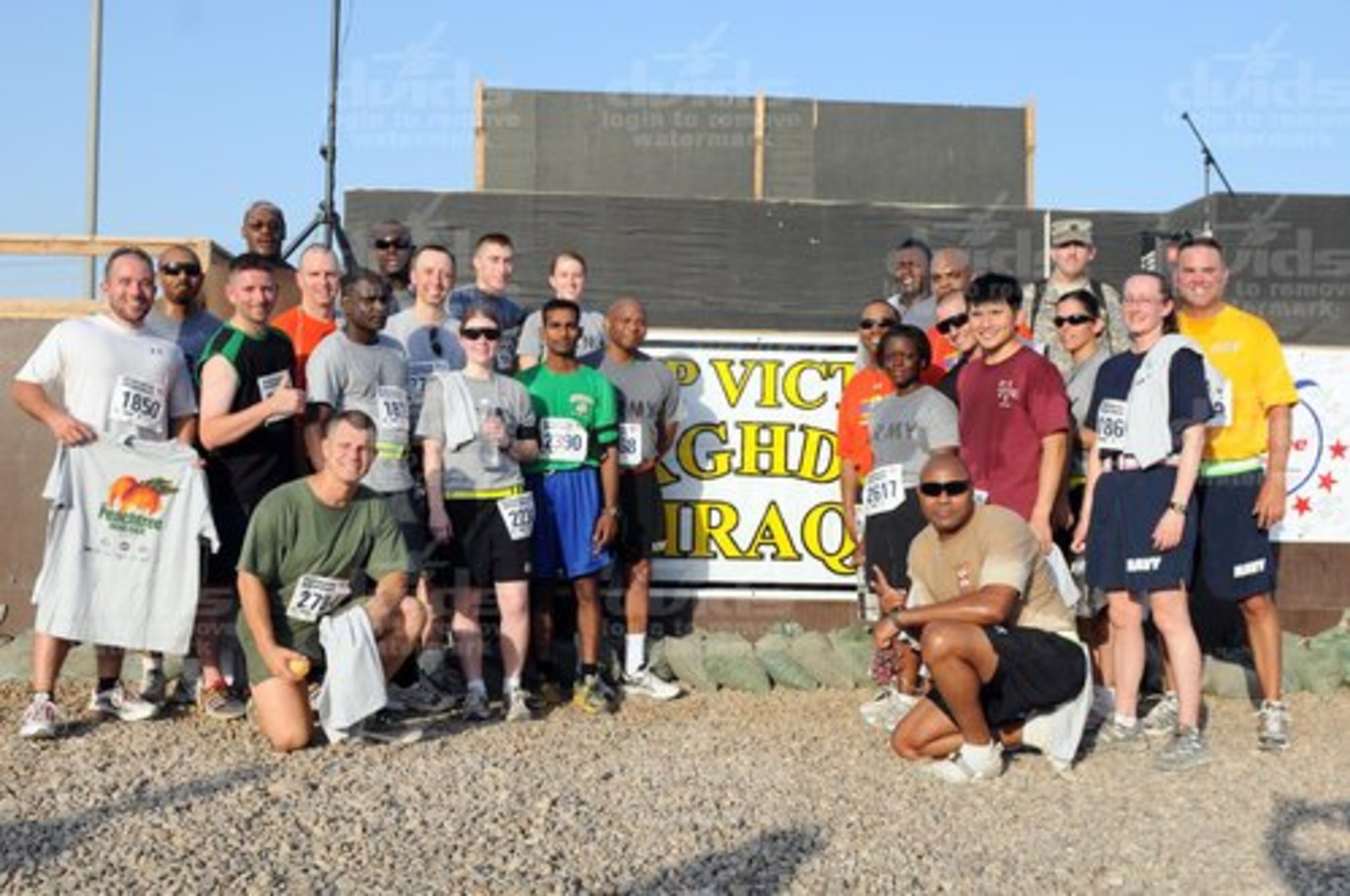 Atlanta area natives pose for a group photo after an AJC Peachtree Road Race at Camp Victory July 4 in Baghdad.