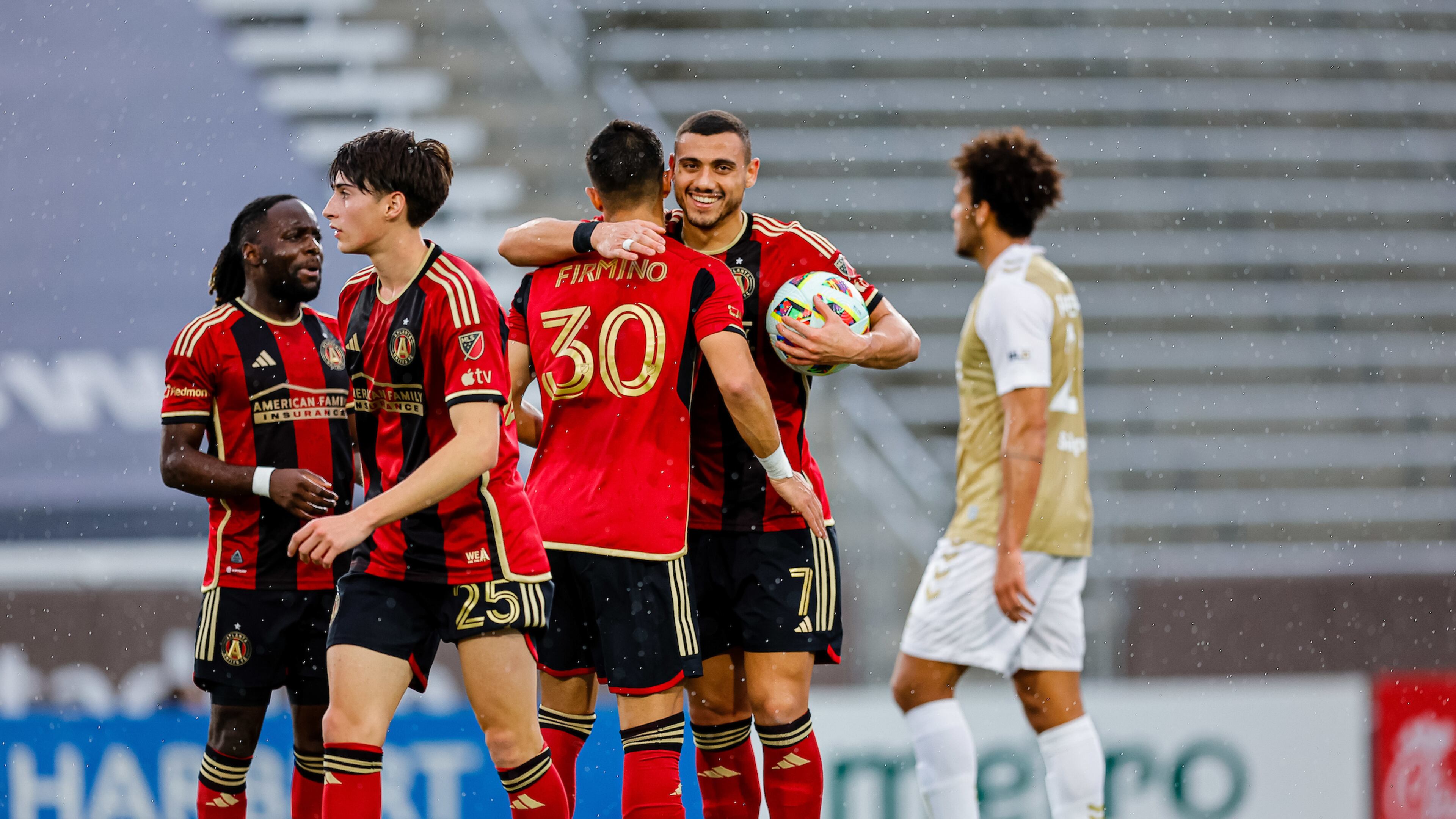 Atlanta United forward Giorgos Giakoumakis and midfielder Nick Firmino celebrate during the match against Birmingham Legion FC at Protective Stadium on Saturday January 27, 2024. (Photo by Alex Slitz/Atlanta United)