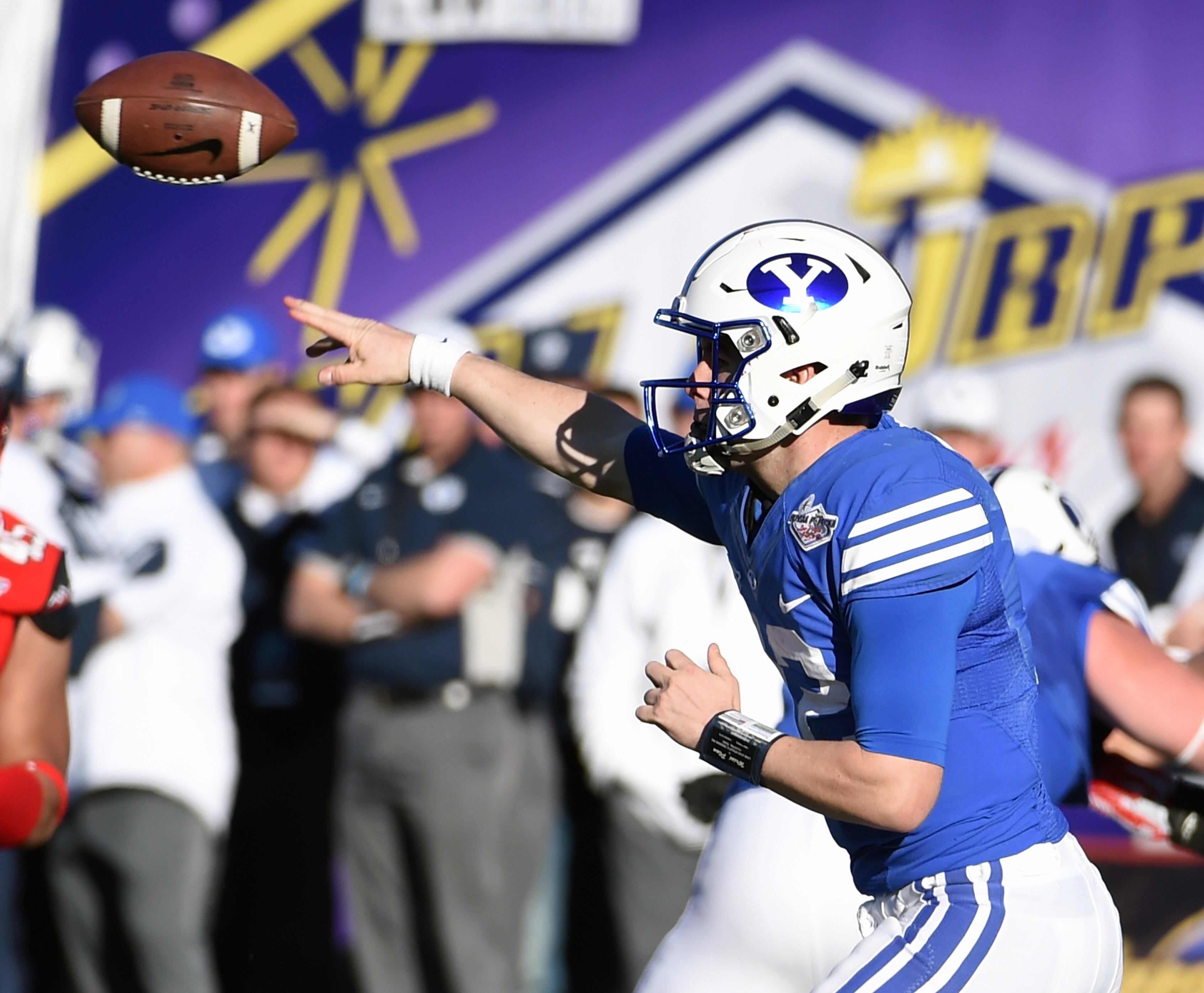 LAS VEGAS, NV - DECEMBER 19: Quarterback Tanner Mangum #12 of the Brigham Young Cougars throws against the Utah Utes during the Royal Purple Las Vegas Bowl at Sam Boyd Stadium on December 19, 2015 in Las Vegas, Nevada. Utah won 35-28. (Photo by Ethan Miller/Getty Images)