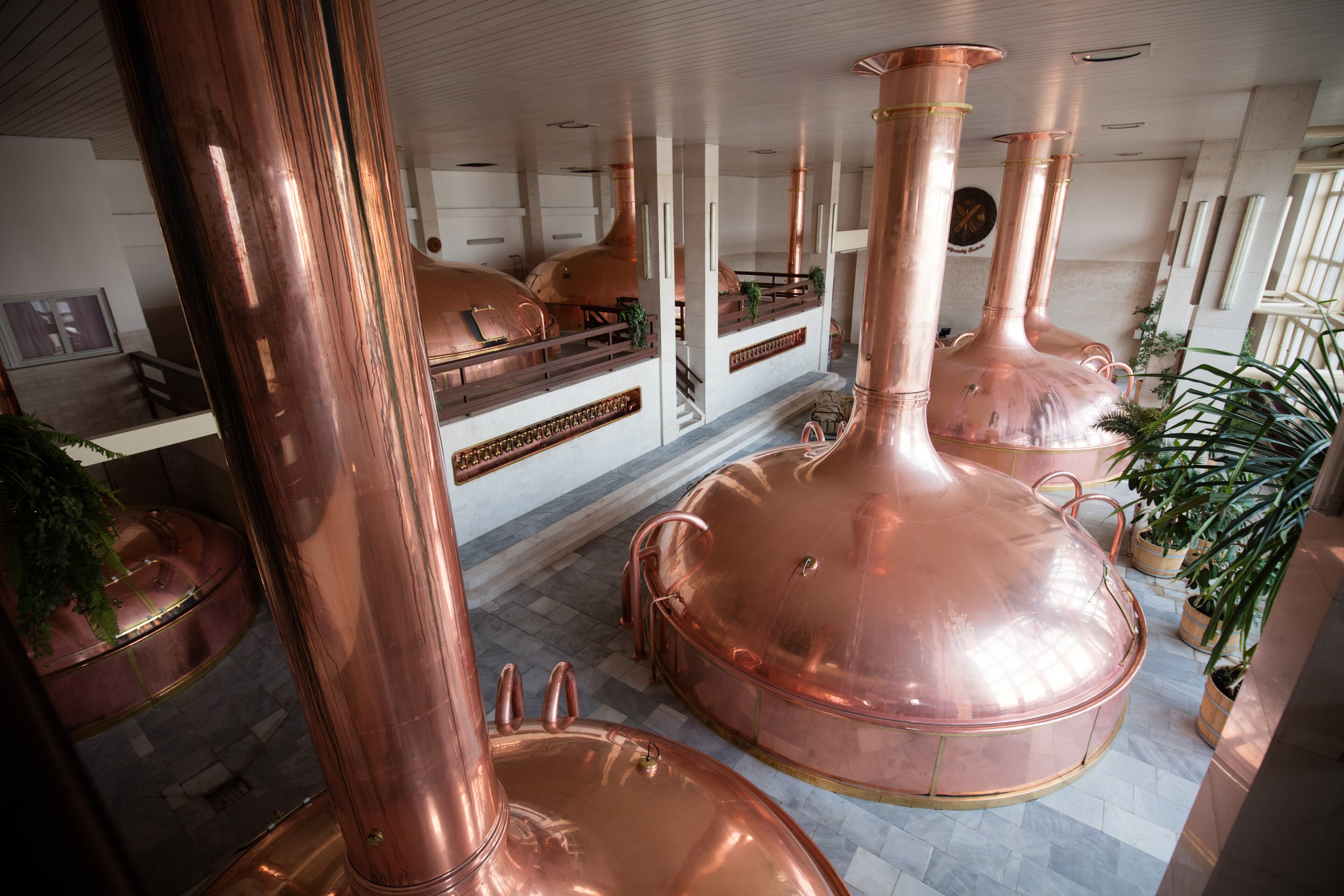 CESKE BUDEJOVICE, CZECH REPUBLIC - SEPTEMBER 25: A general view copper tanks in the brew house is seen at the Budweiser Budvar brewery on September 25, 2015 in Ceske Budejovice, Czech Republic. October 7 2015 sees the 120th anniversary of the Czech Budweiser Budvar Brewery. Budweiser Budvar Beer uses locally-grown Saaz hops, which are ranked among the best in the world, and requires soft water that is drawn from wells situated below the brewery that are well over 9000 years old. In the Czech Republic an old proverb says: "It takes only a sip to know a good beer, but it is best to be sure". (Photo by Matt Cardy/Getty Images)2