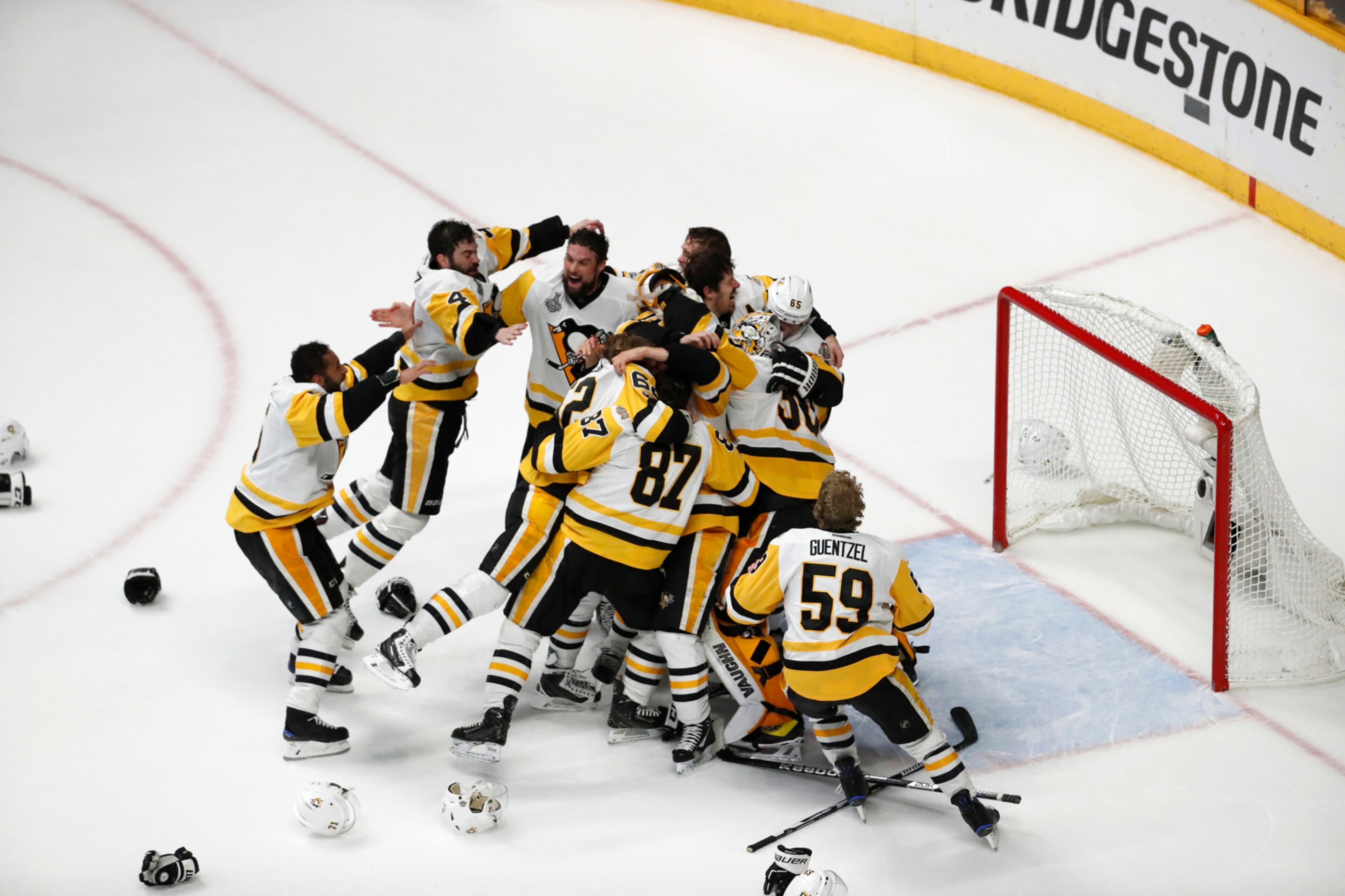 Pittsburgh Penguins players celebrate after defeating Nashville Predators 2-0 in Game 6 of the NHL hockey Stanley Cup Final, Sunday, June 11, 2017, in Nashville, Tenn. (AP Photo/Jeff Roberson)