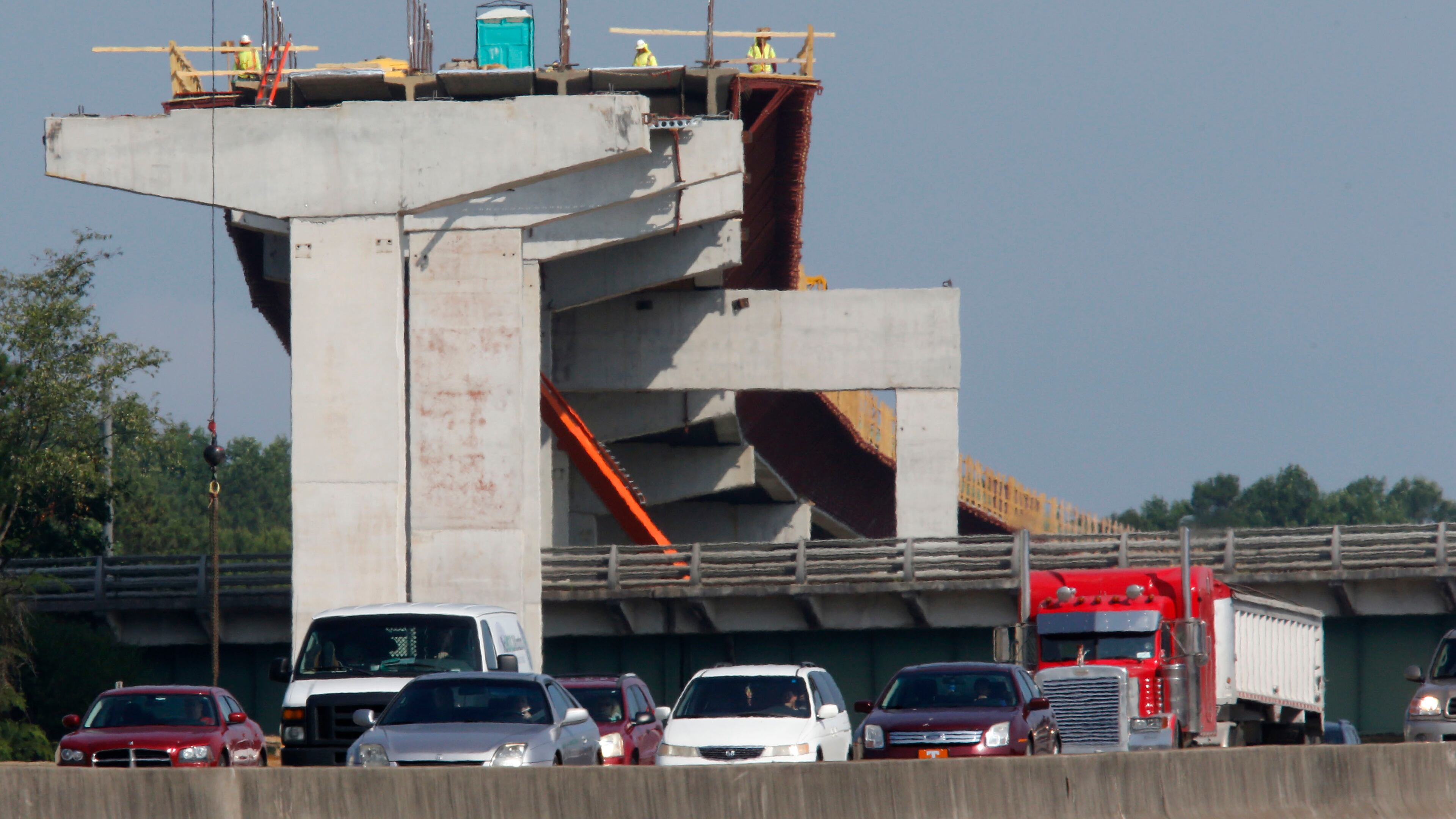 This view shows the express lane bridge over the Canton Road Connector. I-75 southbound is in the foreground. BOB ANDRES / BANDRES@AJC.COM