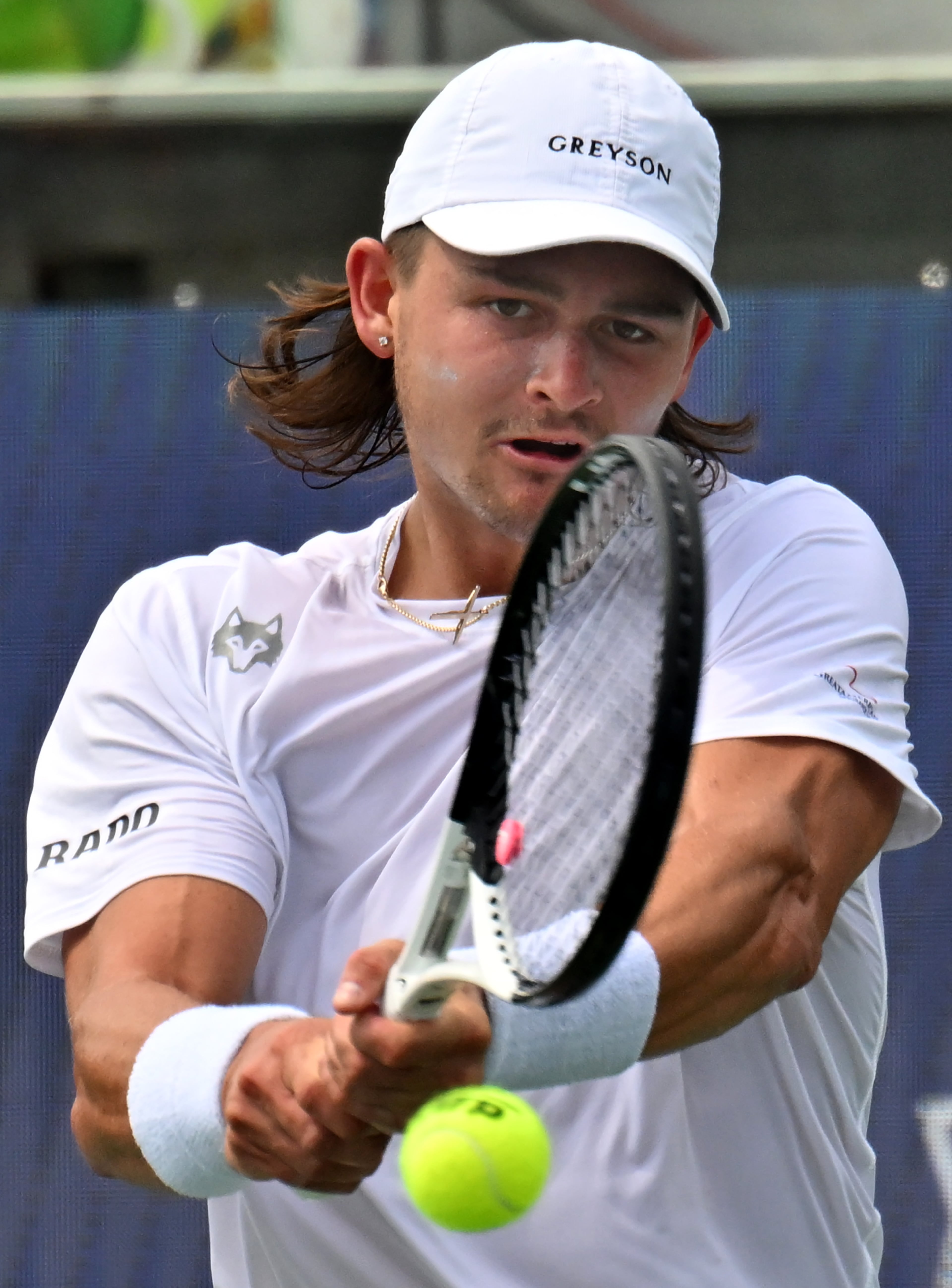 J.J. Wolf returns the ball to Taylor Fritz during a semifinal match at the 2023 Atlanta Tennis Open at Atlantic Station, Saturday, July 29, 2023, in Atlanta. (Hyosub Shin / Hyosub.Shin@ajc.com)