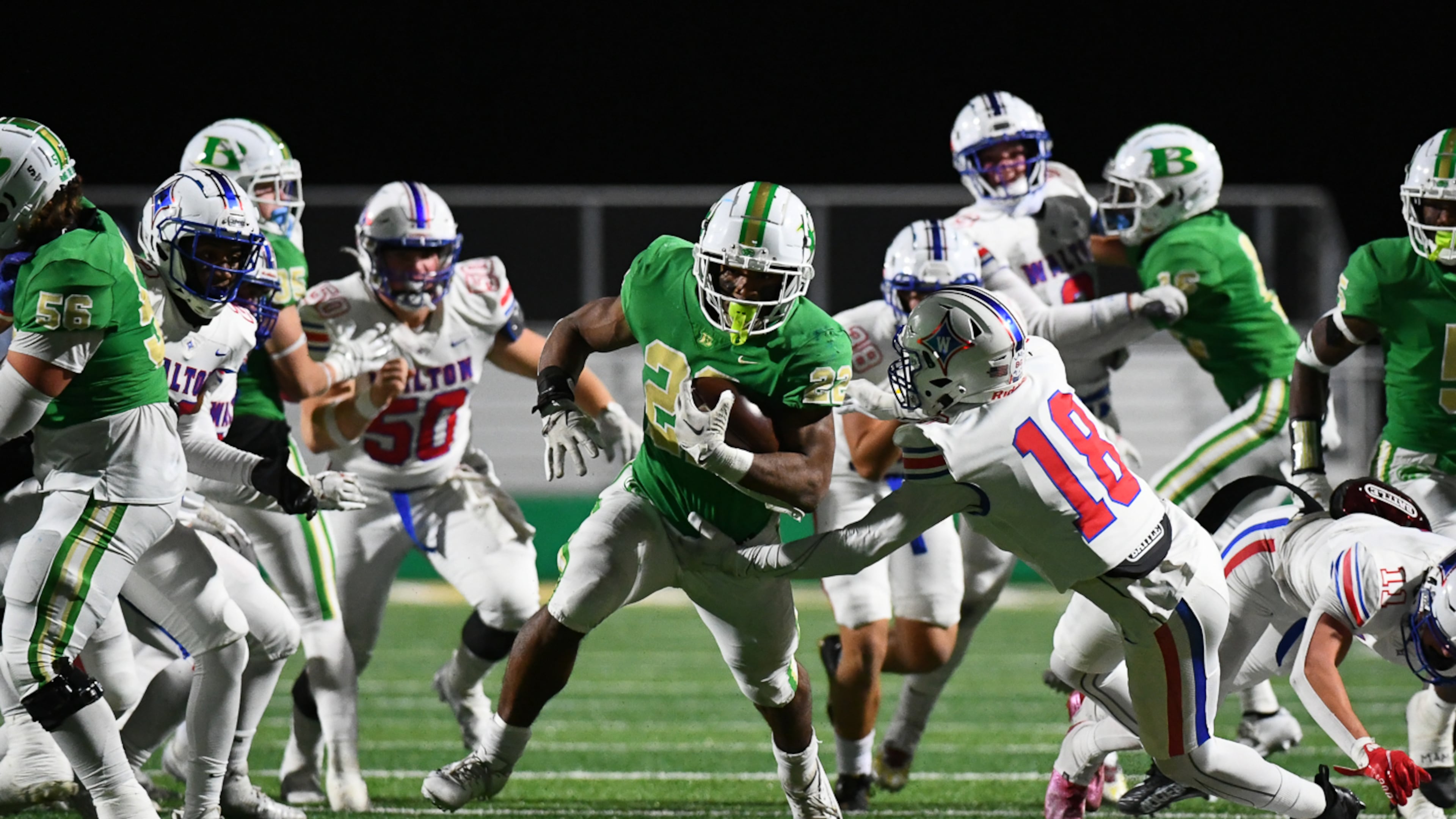 Justice Haynes, running back for Buford, runs the ball down for a touchdown during the Walton vs. Buford High School Football game on Friday, Nov. 18, 2022, at Buford High School in Buford, Georgia. (Jamie Spaar for the Atlanta Journal Constitution)