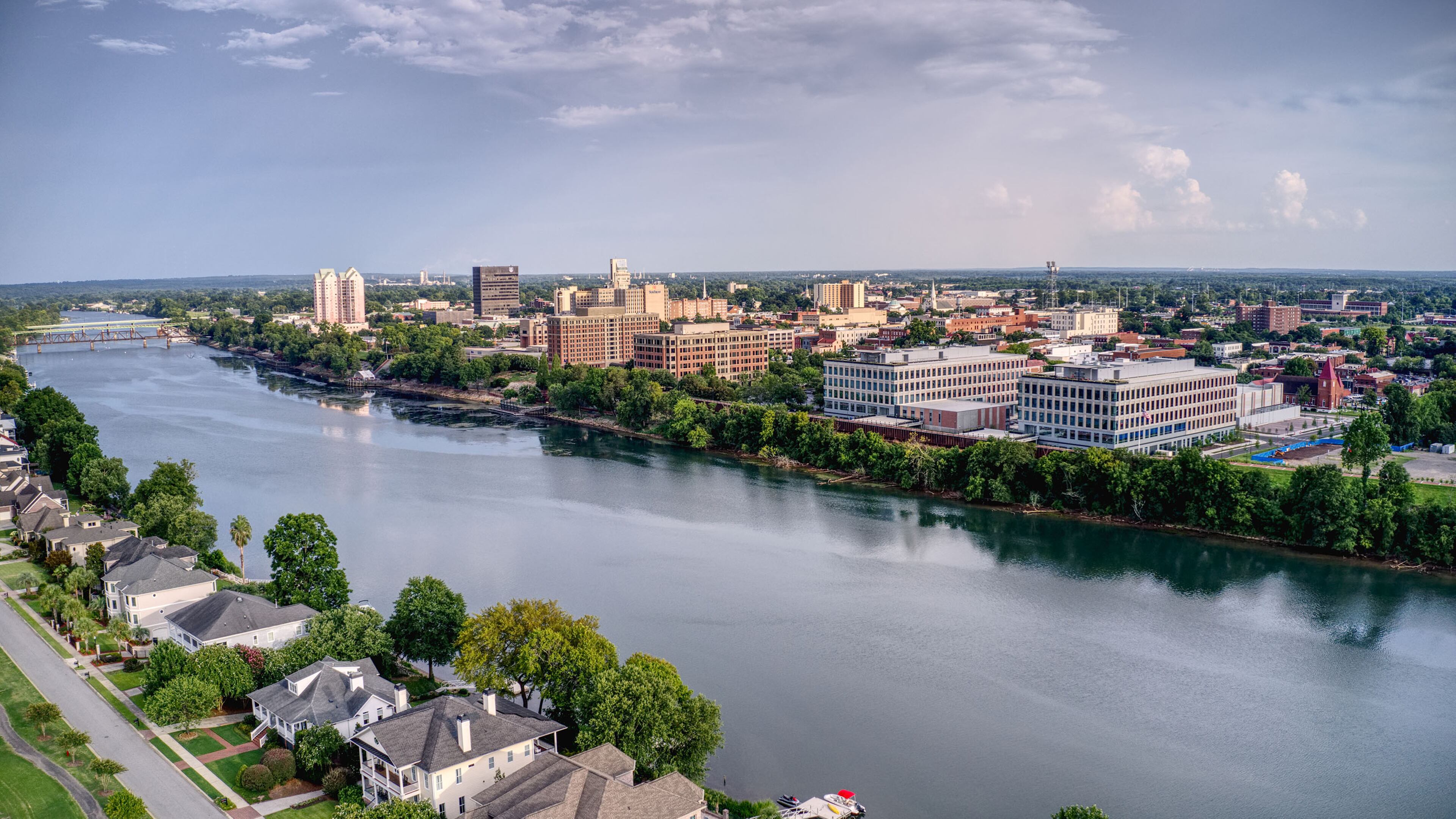 The skyline of downtown Augusta reflects in the Savannah River. (Destination Augusta/TNS)