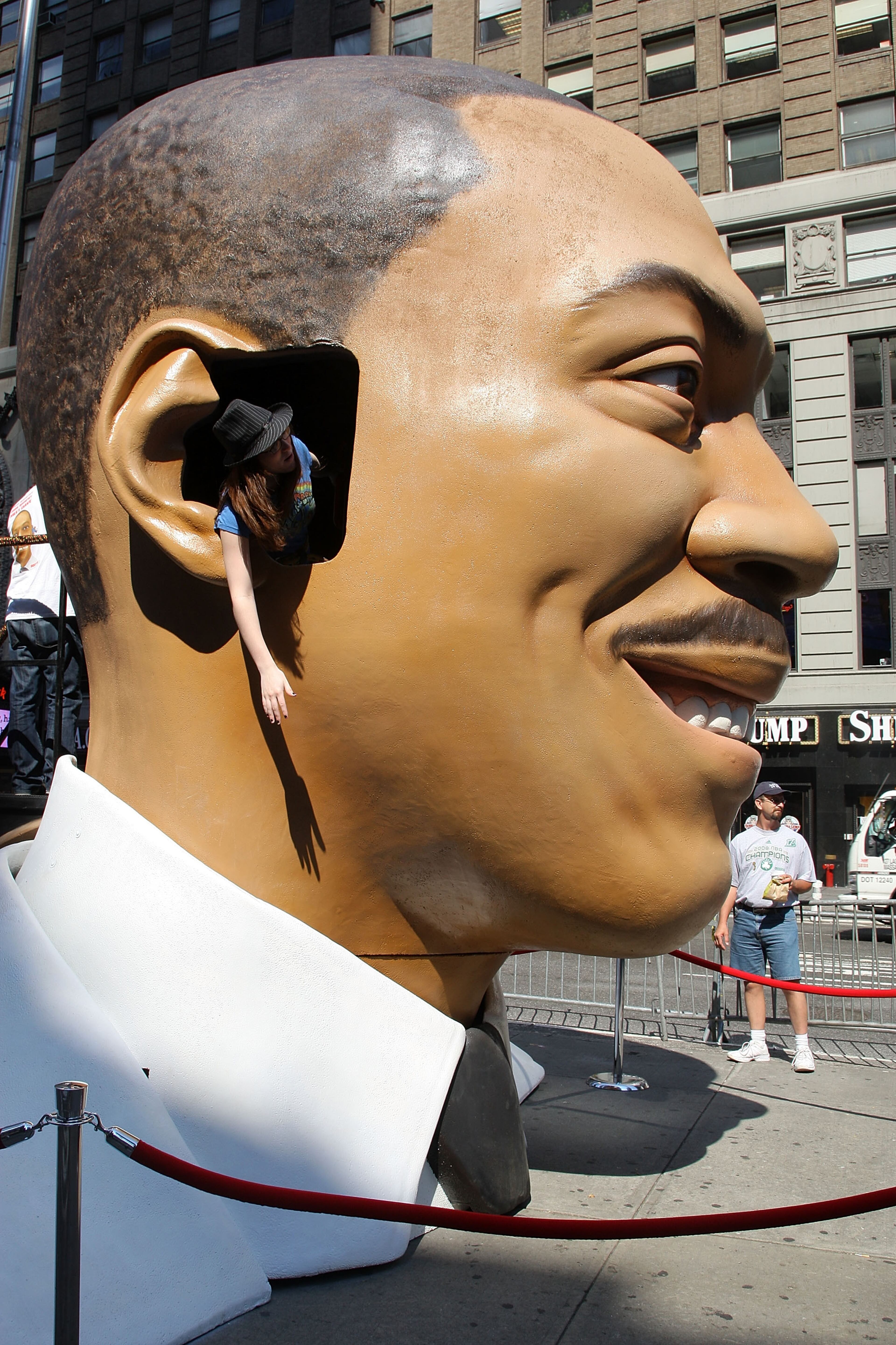 NEW YORK - JULY 03: Overview of a girl leaning out of the "Meet Dave" 15-Foot replica of Eddie Murphy's Head at Military Island in Times Square on July 3, 2008 in New York City. (Photo by Andrew H. Walker/Getty Images)