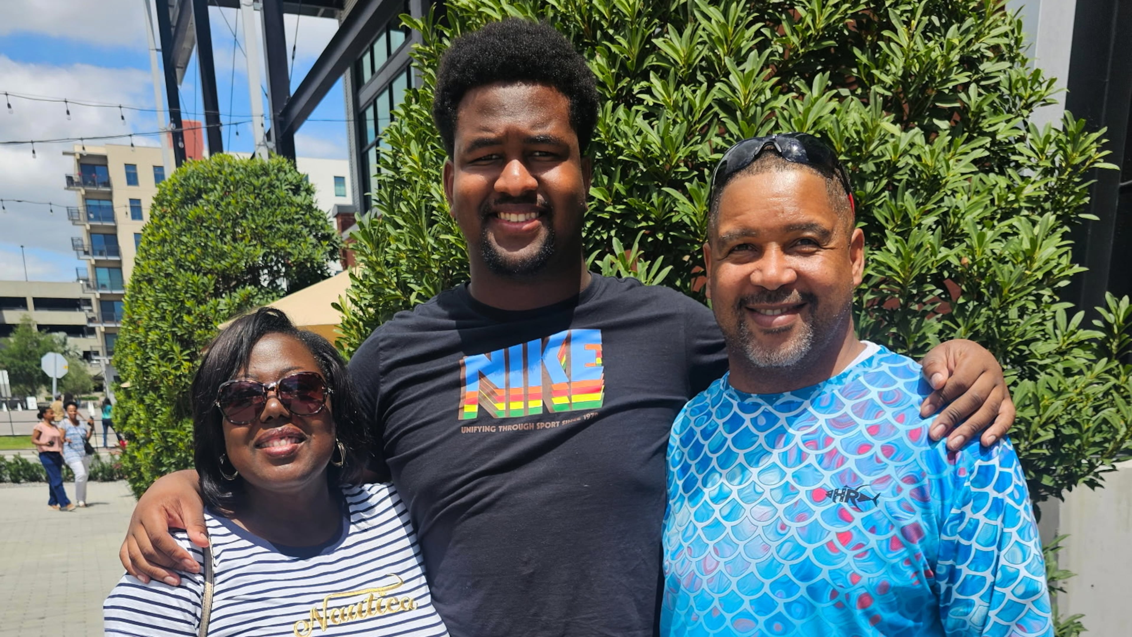 Calvin Dickey Jr., center, poses for a photo with his father, Calvin Dickey Sr., and mother, Nicole Dickey, in Tampa, Fla., on March 31, 2024. (Courtesy of Calvin Dickey Sr. via AP)