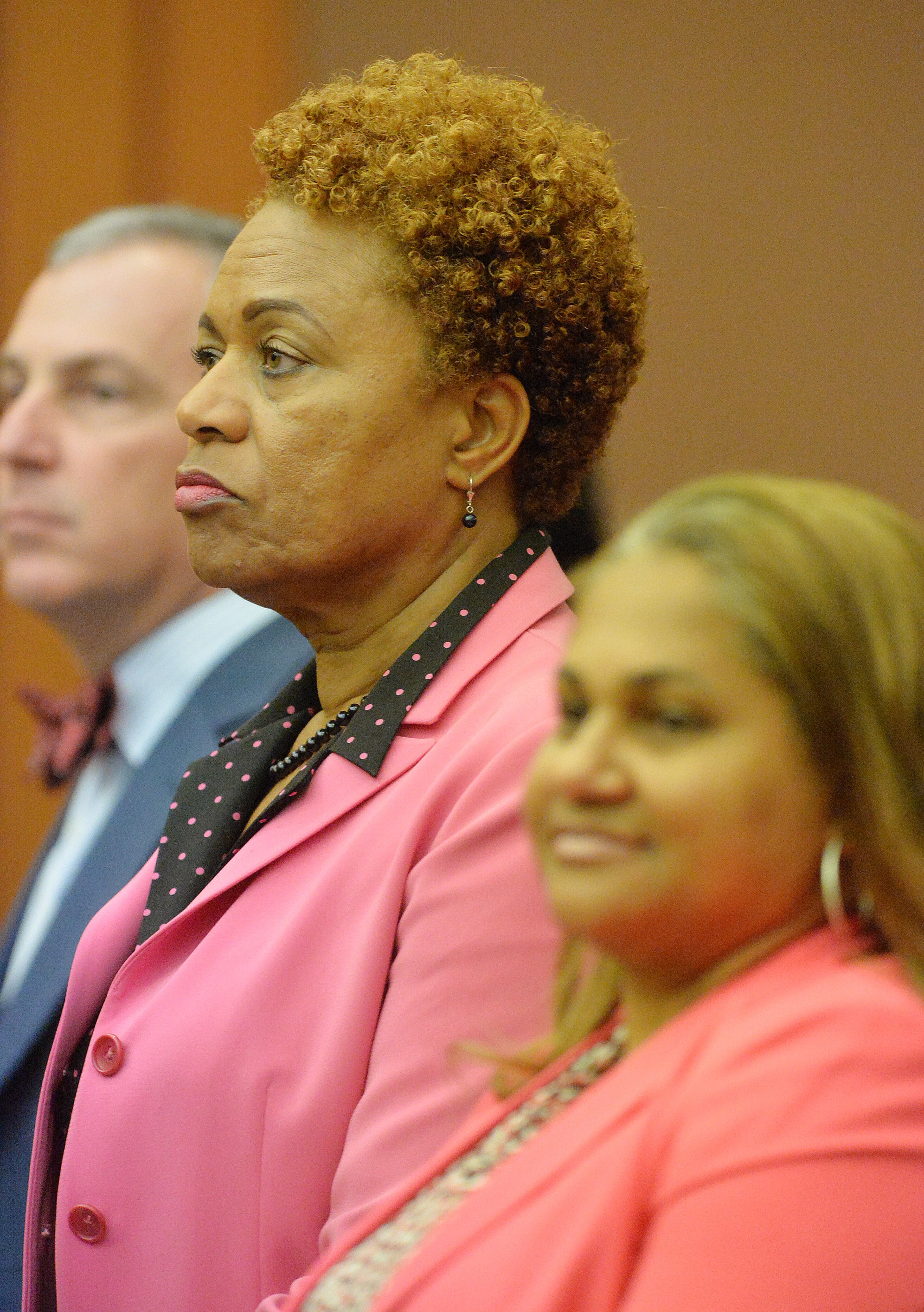 Former APS SRT Director Sharon Davis Williams and her defense attorney Teresa Mann stand as the verdict is read. She was found guilty on Violation of Racketeer Influenced and Corrupt Organizations Act. A jury of six men and six women rendered their verdicts on the eighth day of deliberations in the Atlanta Public Schools test-cheating trial on Wednesday, April 1, 2015. Jurors sorted through roughly five months of testimony against 12 former educators accused of engaging in a racketeering conspiracy to inflate test scores. (Atlanta Journal-Constitution, Kent D. Johnson, Pool)